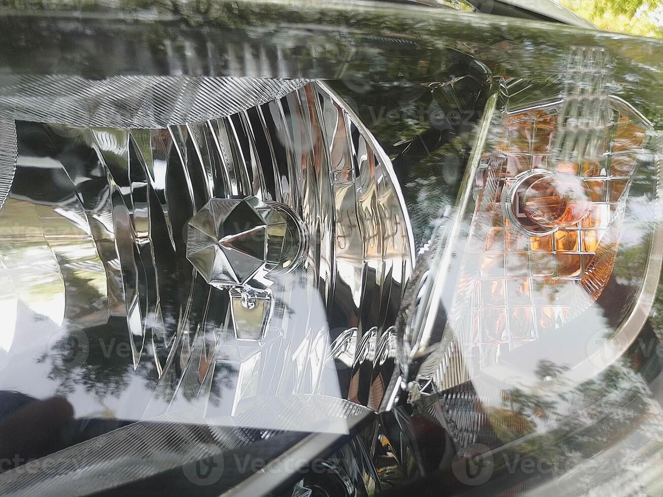 Closeup view of Car Head light with turn signal in it photo