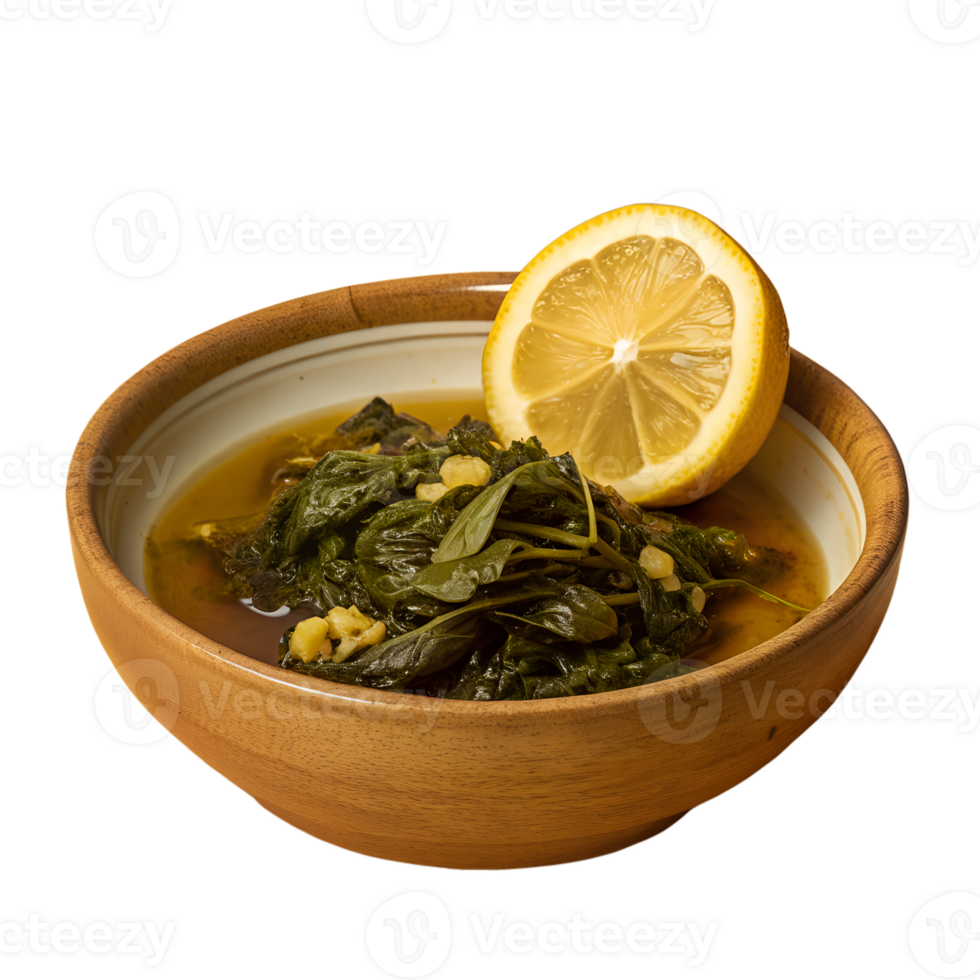 A bowl of freshly cooked spinach in broth with a half lemon slice on top, placed in a wooden bowl on a white background. png