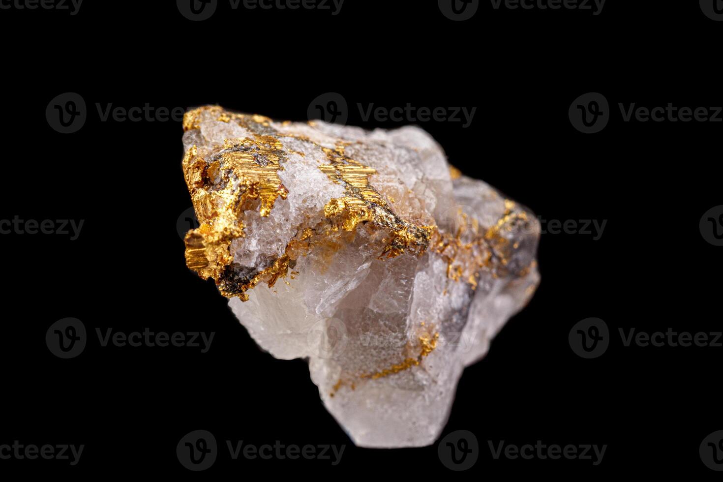 macro mineral stone gold in the rock on a black background photo