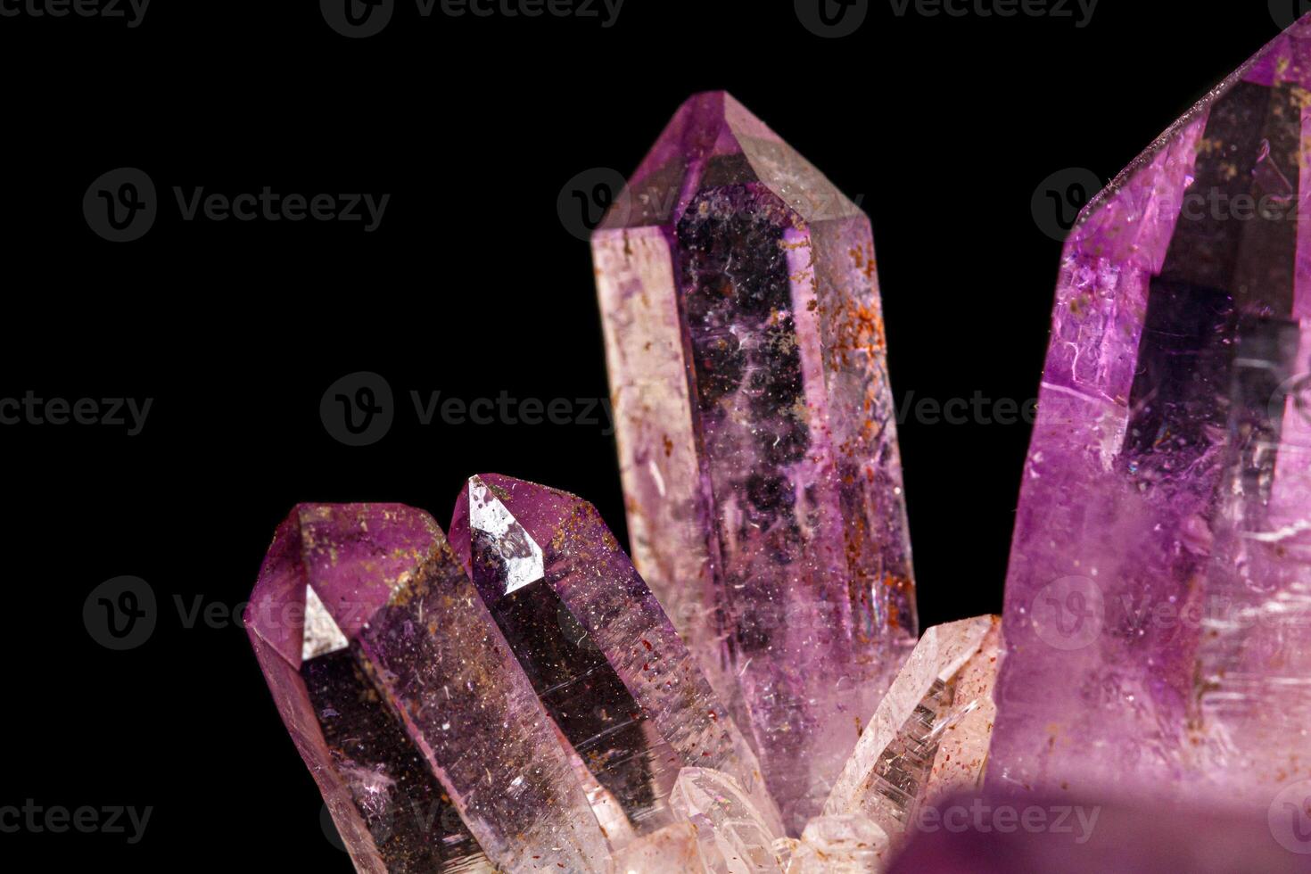 Macro of amethyst mineral stone on black background photo