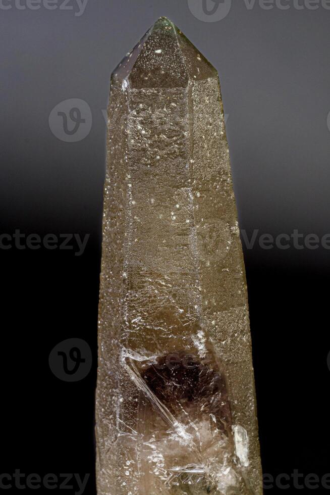 Macro mineral stone Prase with amethyst phantom on a gray background photo