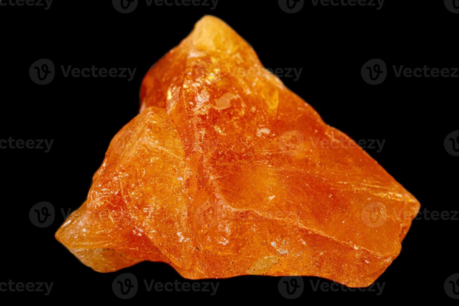 macro mineral stone Scheelite on a black background photo