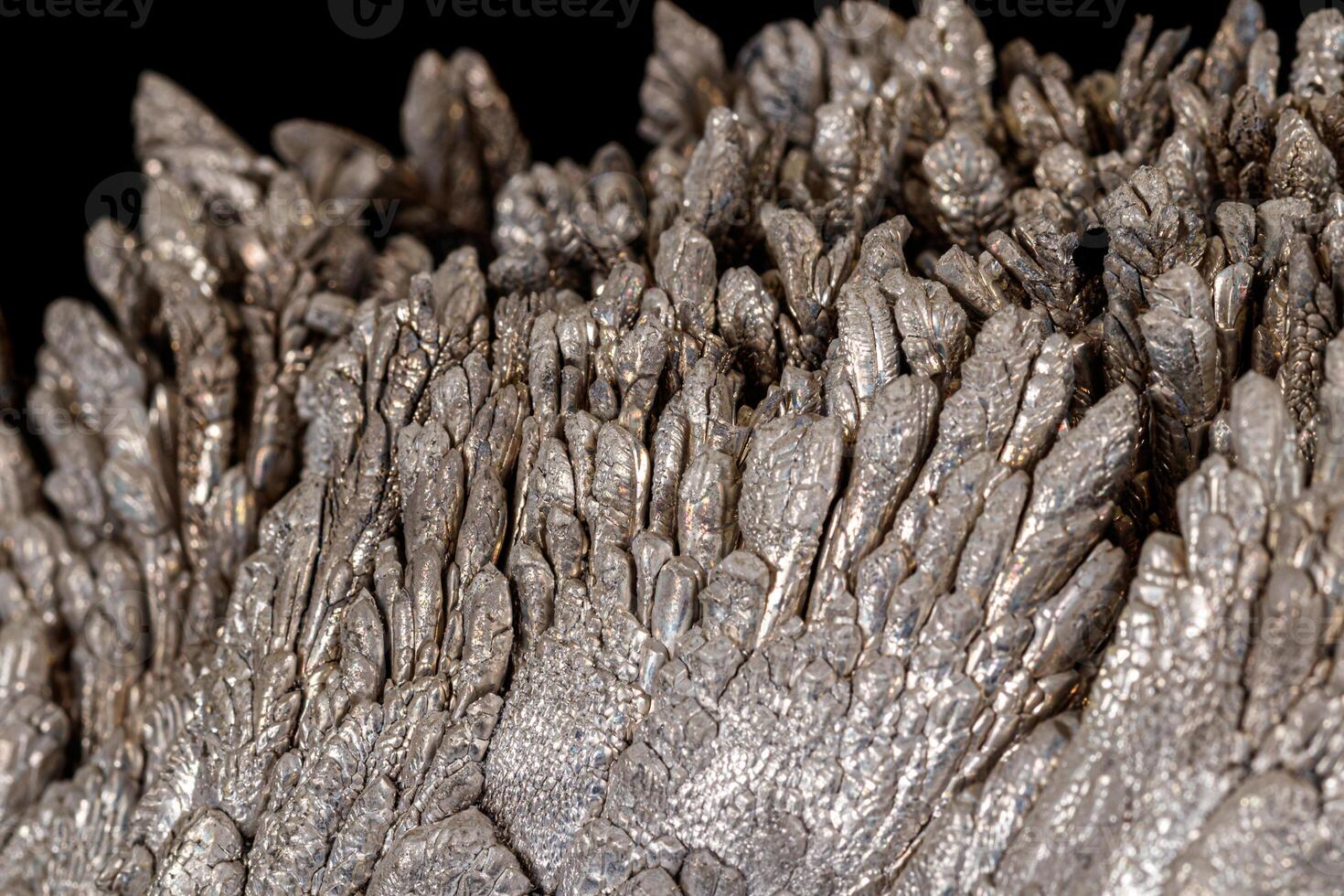 Macro of a stone Stibnite mineral on a black background photo