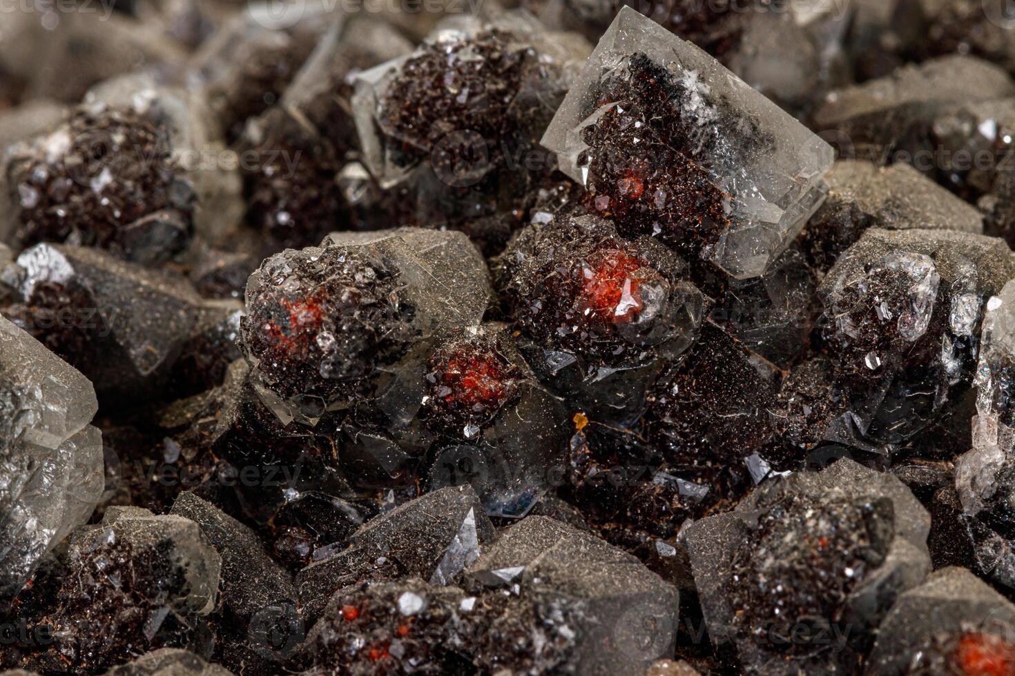 Macro of a stone Ilvaite mineral on a white background photo