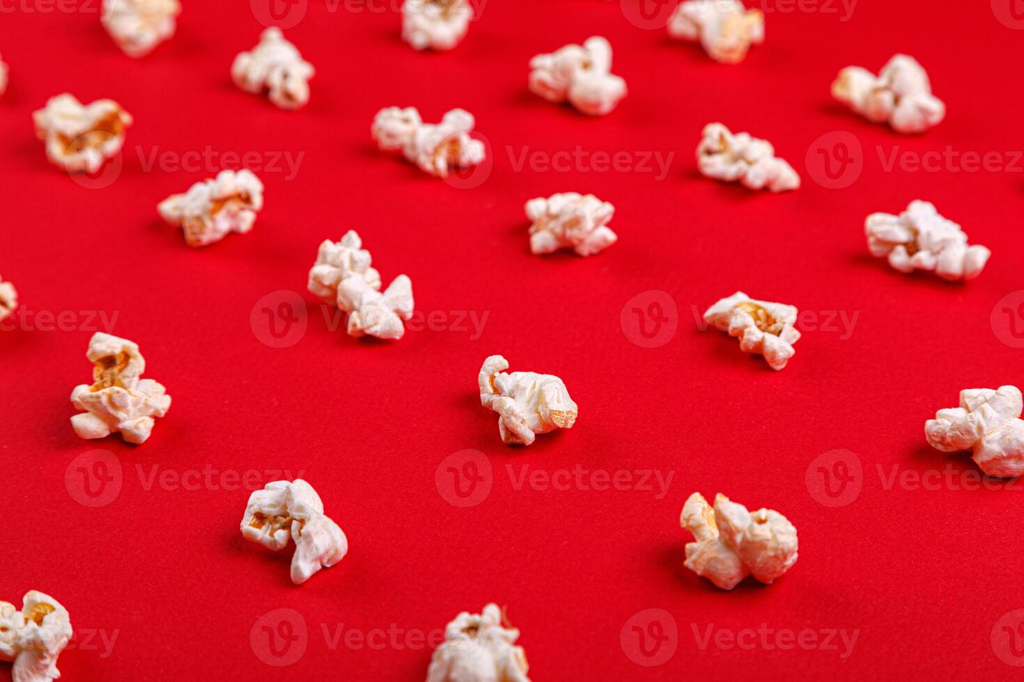 popcorn macro on a red background photo