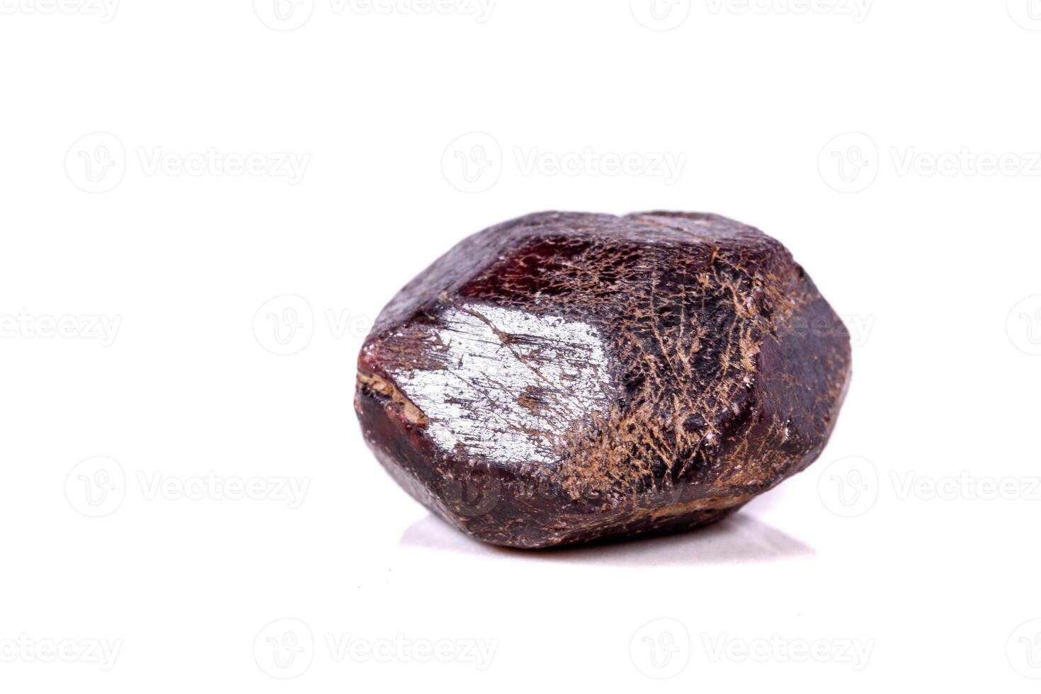 Macro of a mineral garnet stone on a white background photo