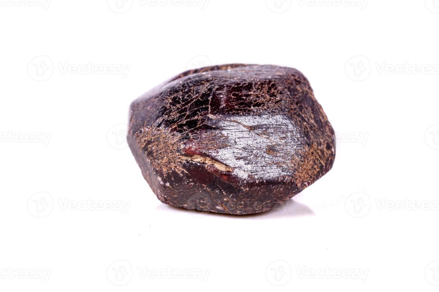 Macro of a mineral garnet stone on a white background photo