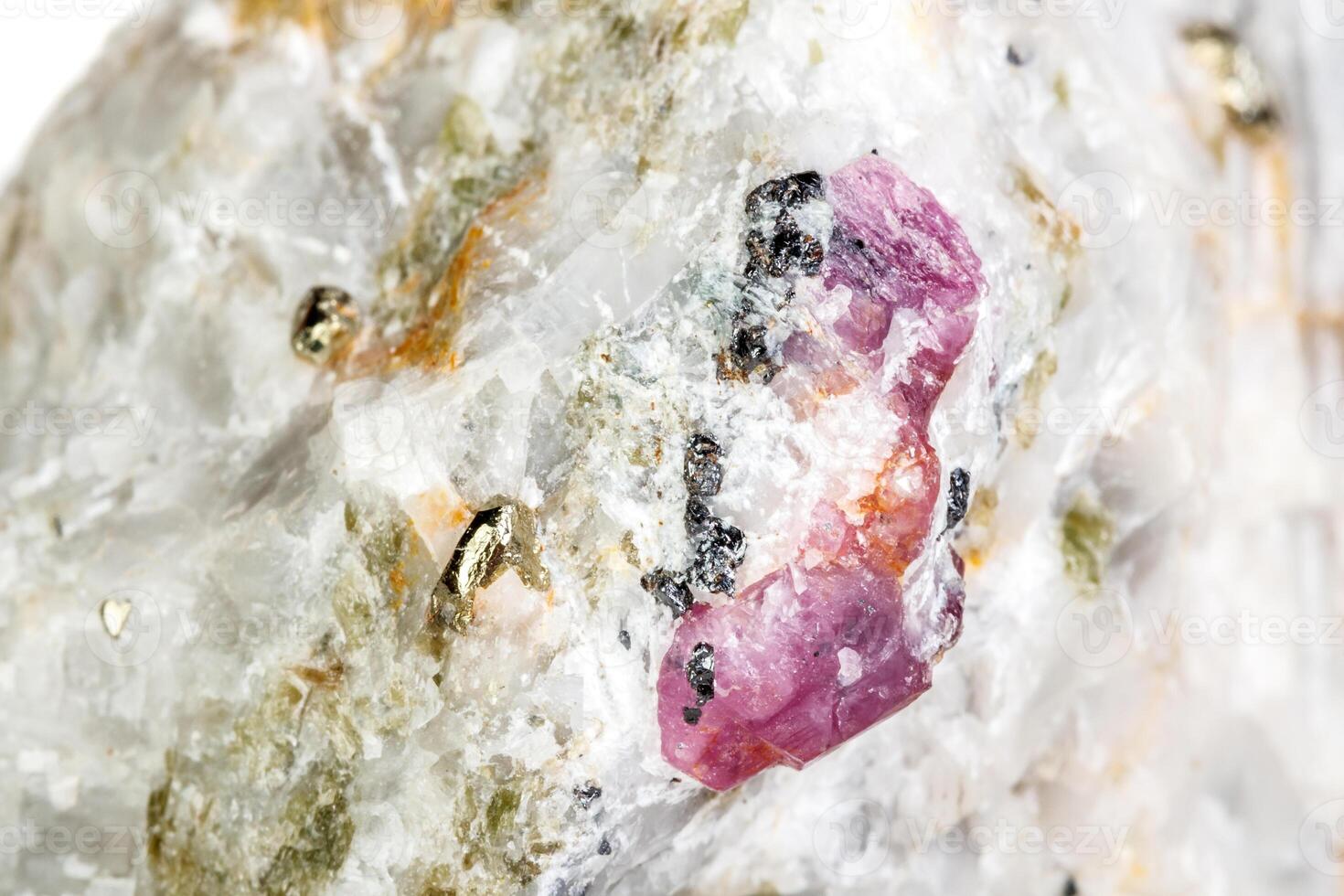 Macro mineral stone Ruby in rock on white background photo