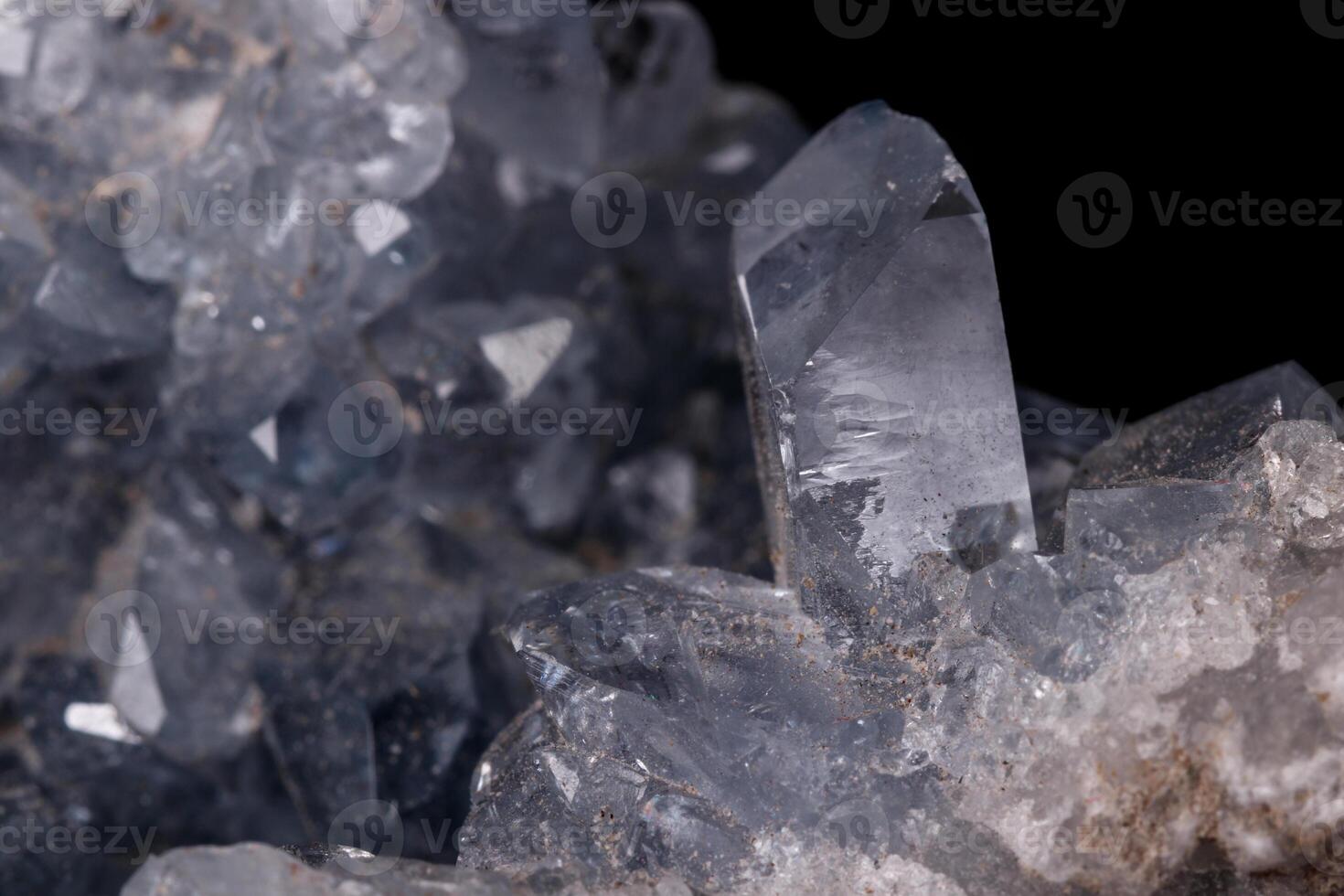 Celestine mineral stone macro on microcline on black background photo