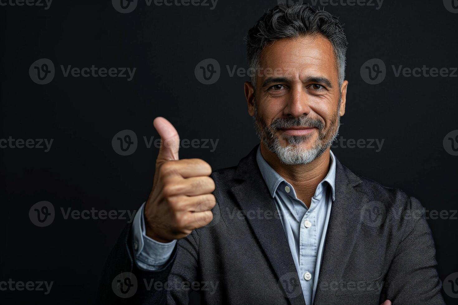 Businessman in Suit Giving Thumbs Up photo