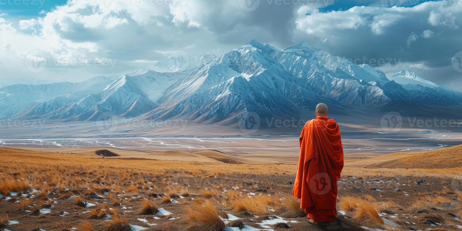 Buddhist Monk Standing in Field photo
