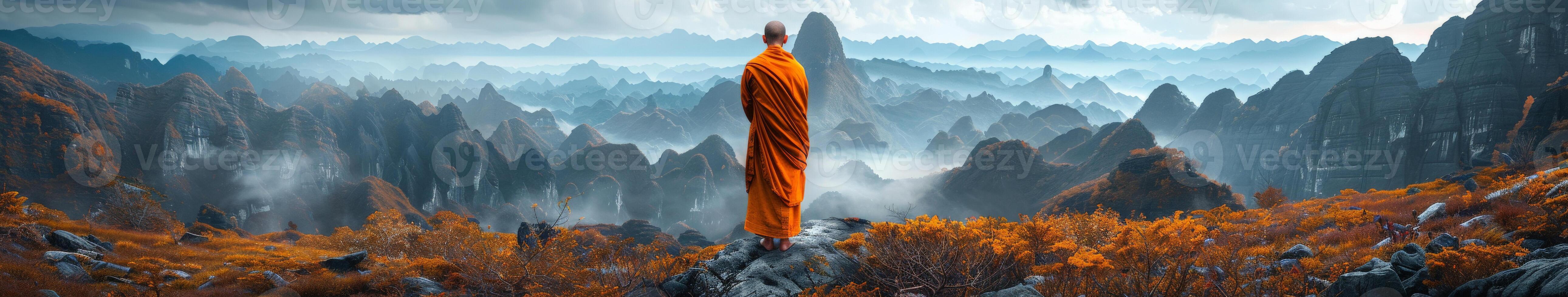 Buddhist Monk Standing on Mountain Top photo