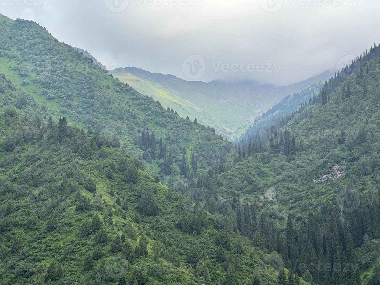 Mountains of Kyrgyzstan. Trekking in the mountains of Kyrgyzstan. Beautiful view of the mountains. Waterfall in the mountains. Central Asia, Kyrgyzstan. photo