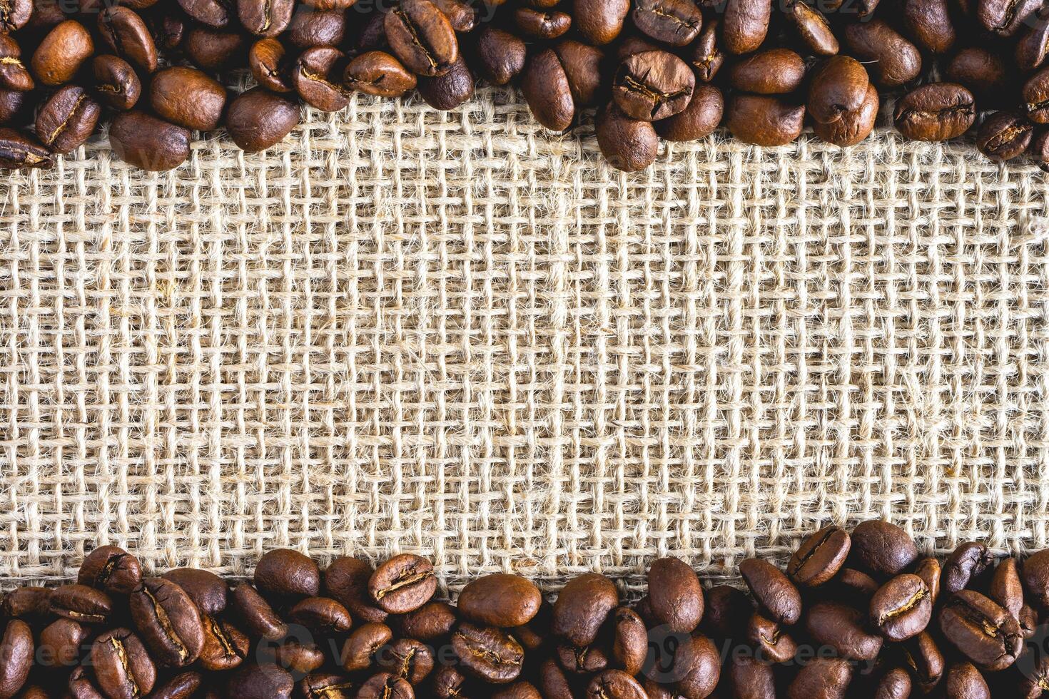 A frame of Coffee beans, on Burlap fabric. Background voor coffee related products. photo