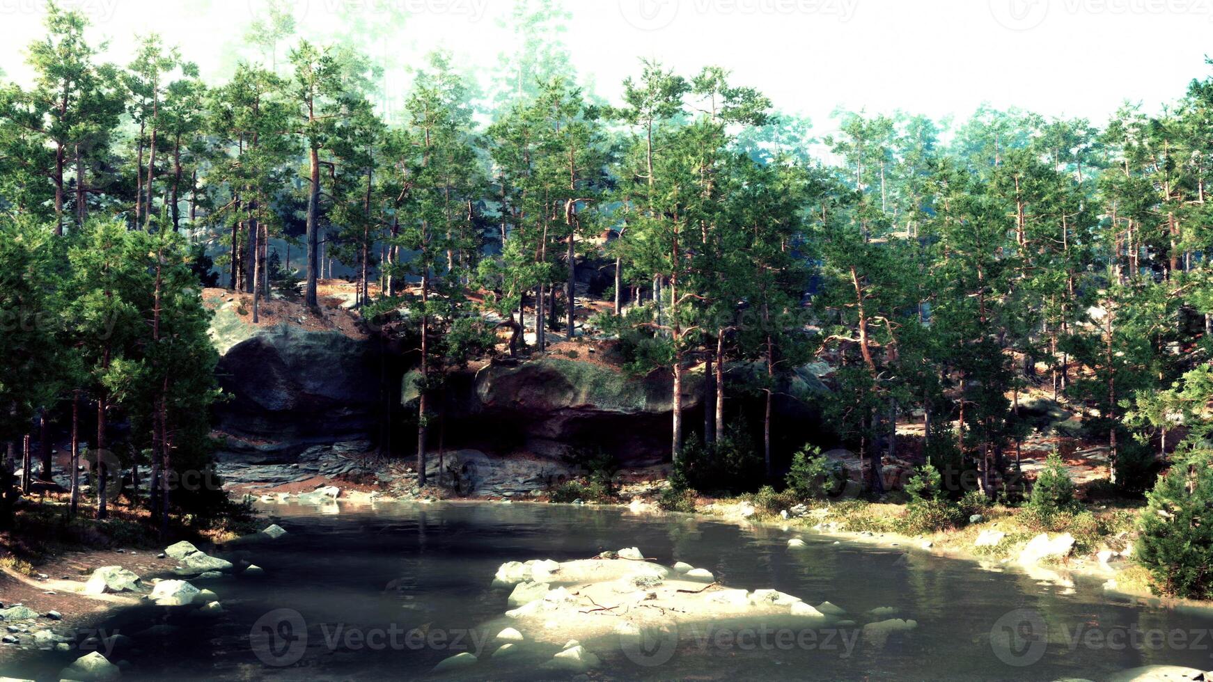 A small lake surrounded by trees and rocks photo