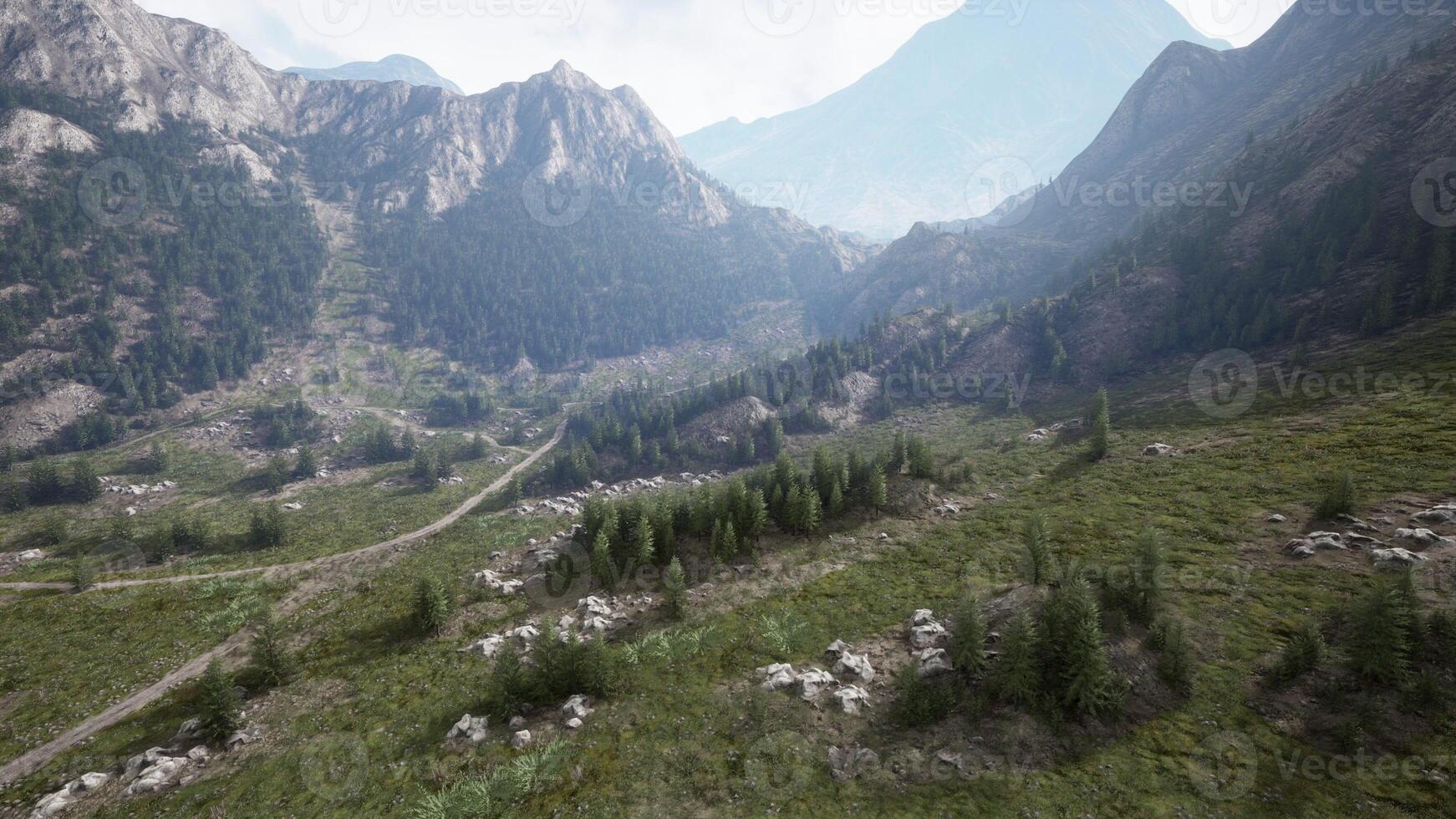 A breathtaking mountain valley with lush green trees photo