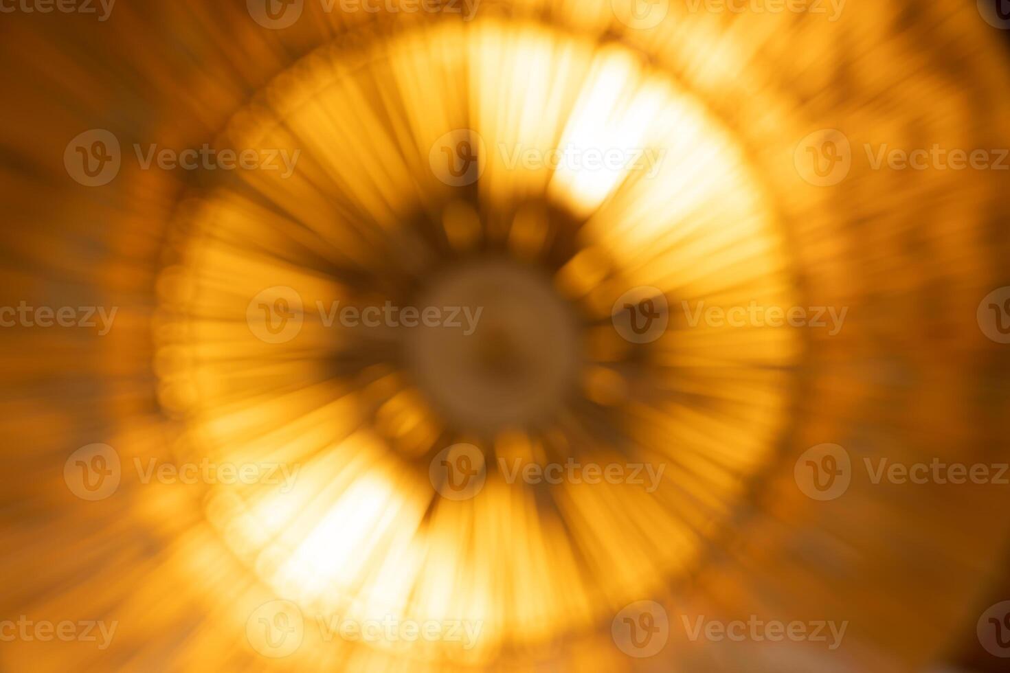 Abstract blur orange light - beam radius movement and explosion like a bomb or the other way view looks like sunflower abstract shape art. photo