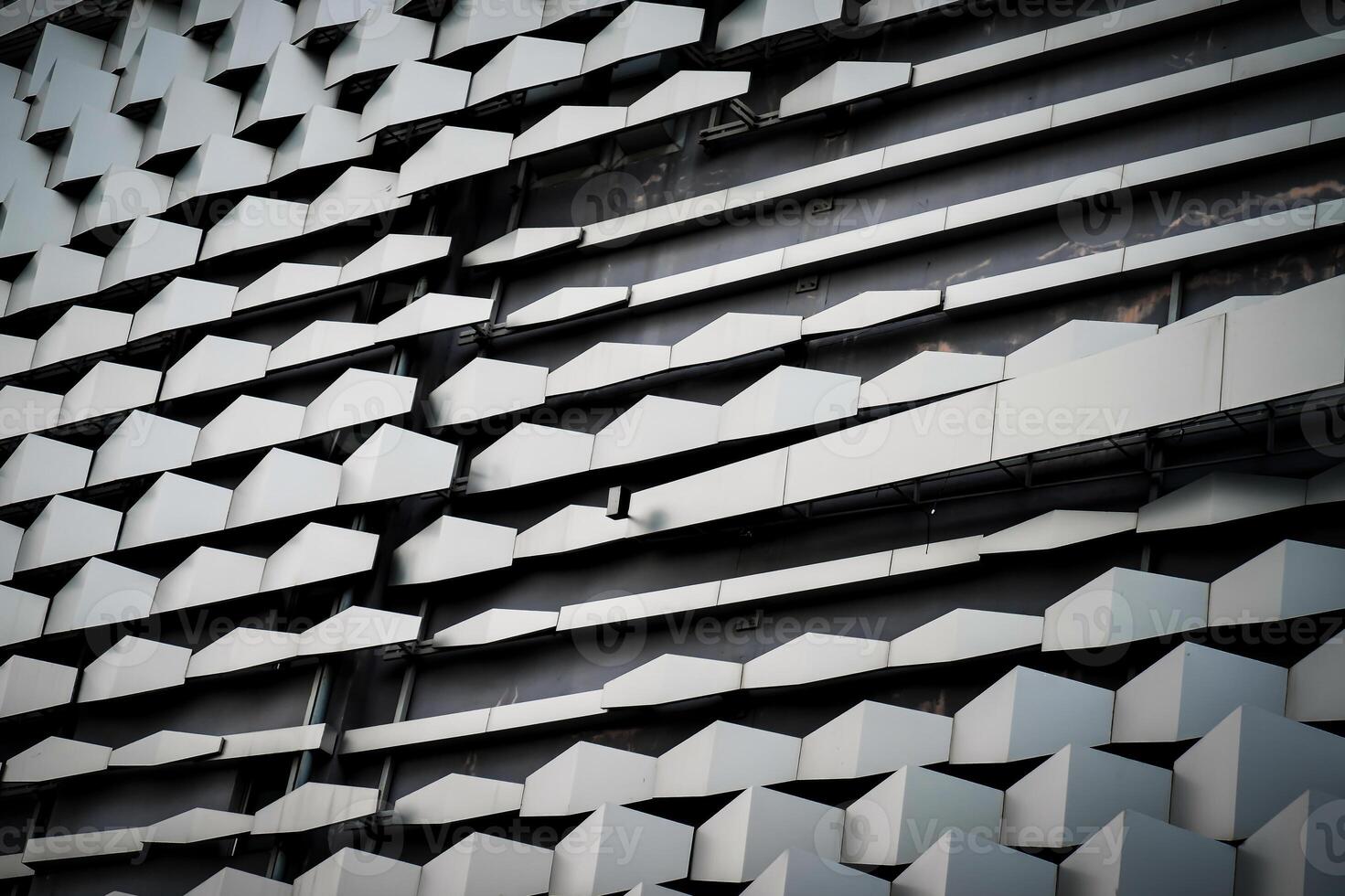 modern Aluminium composite material architecture gray color and Hexagon shape popup texture on exterior facade building. photo