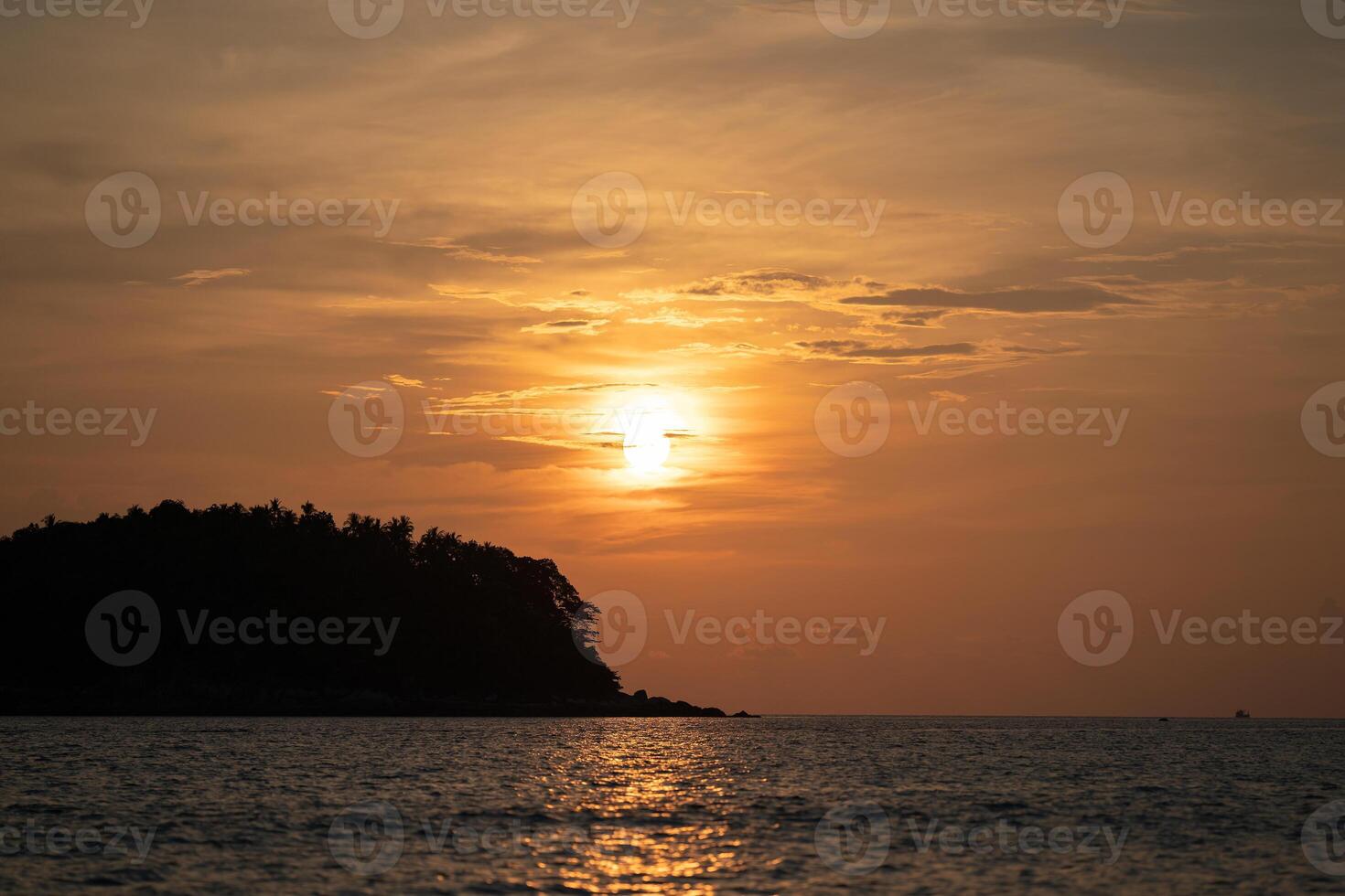 Sunset view with the cloud cover the sun on Kata Beach on Phuket island, Phuket Province, Thailand. photo
