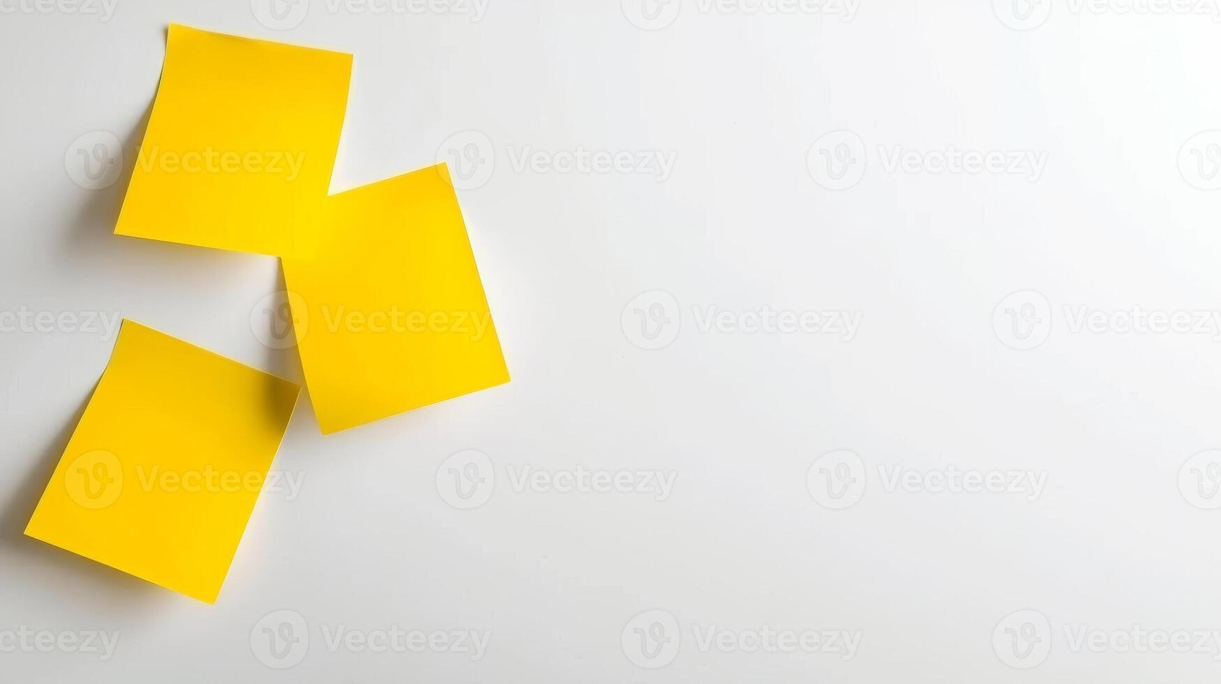 Blank yellow paper taped to the wall for writing messages. photo