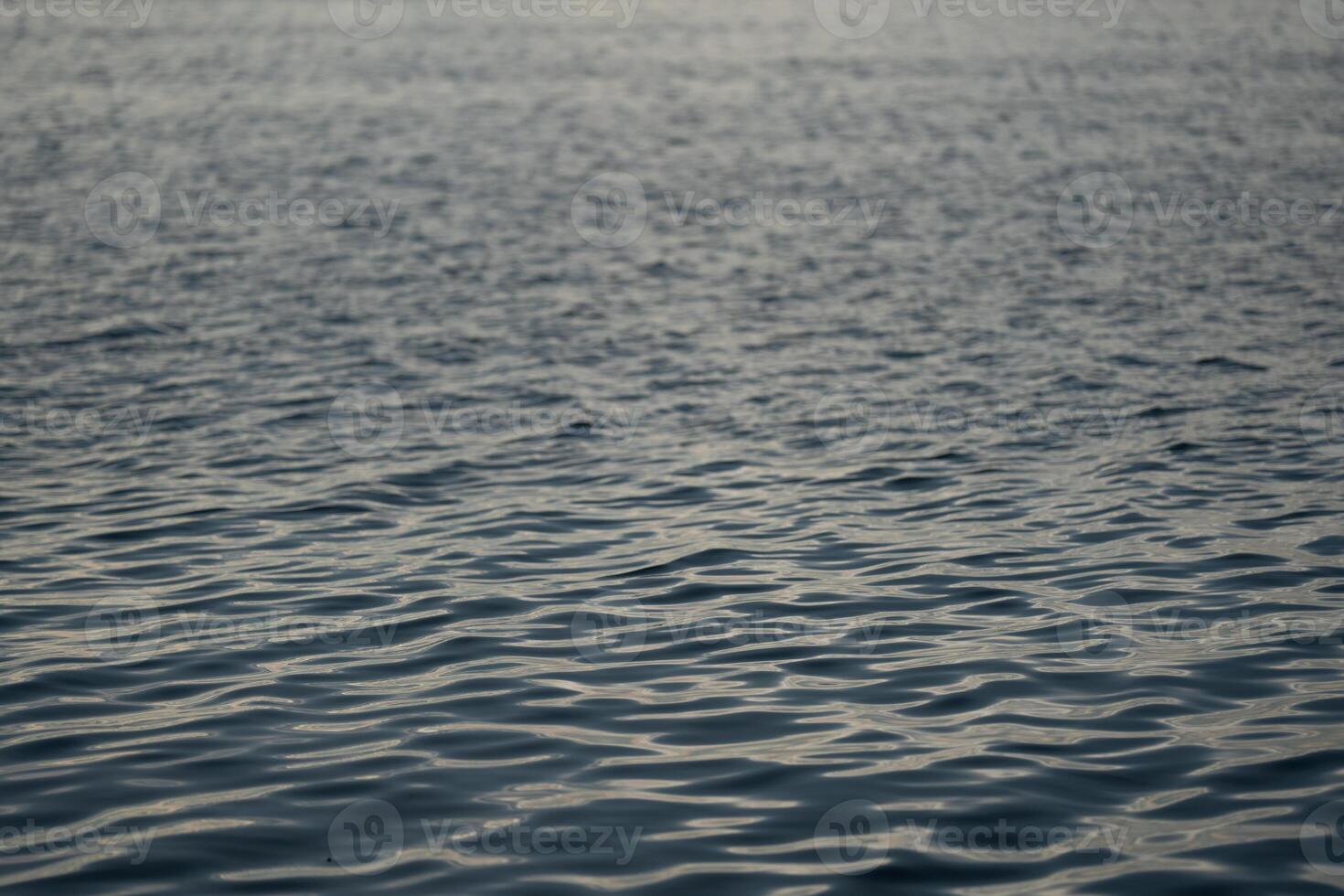 dark wave sea surface in the night without any thing on it. photo