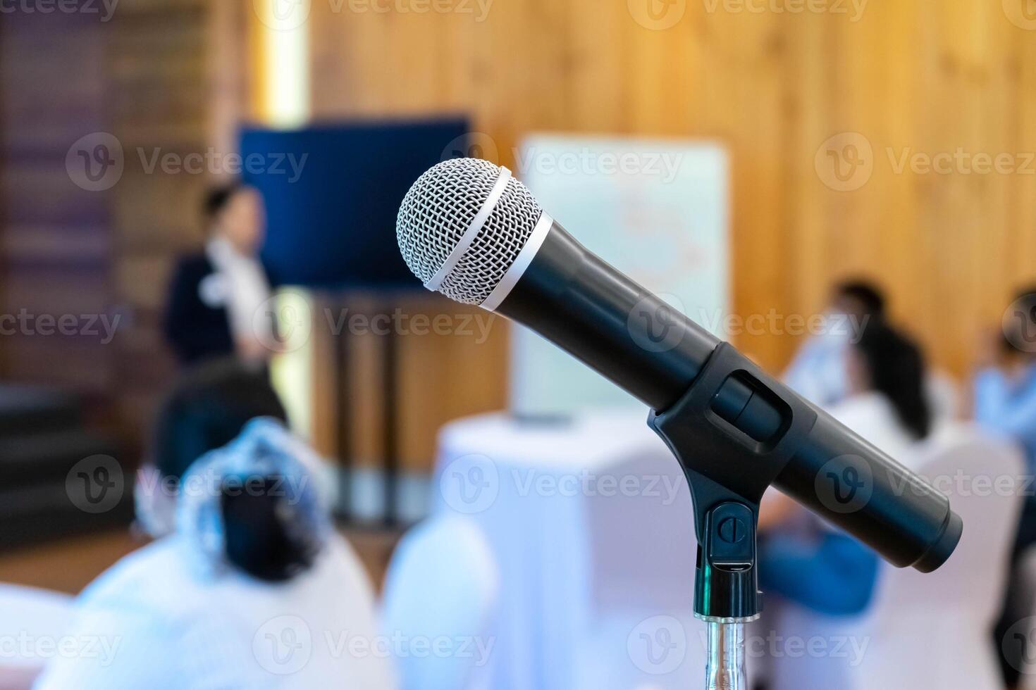 microphone is on microphone stand in seminar meeting room for everyone to use when speaking or greeting seminar participants. photo