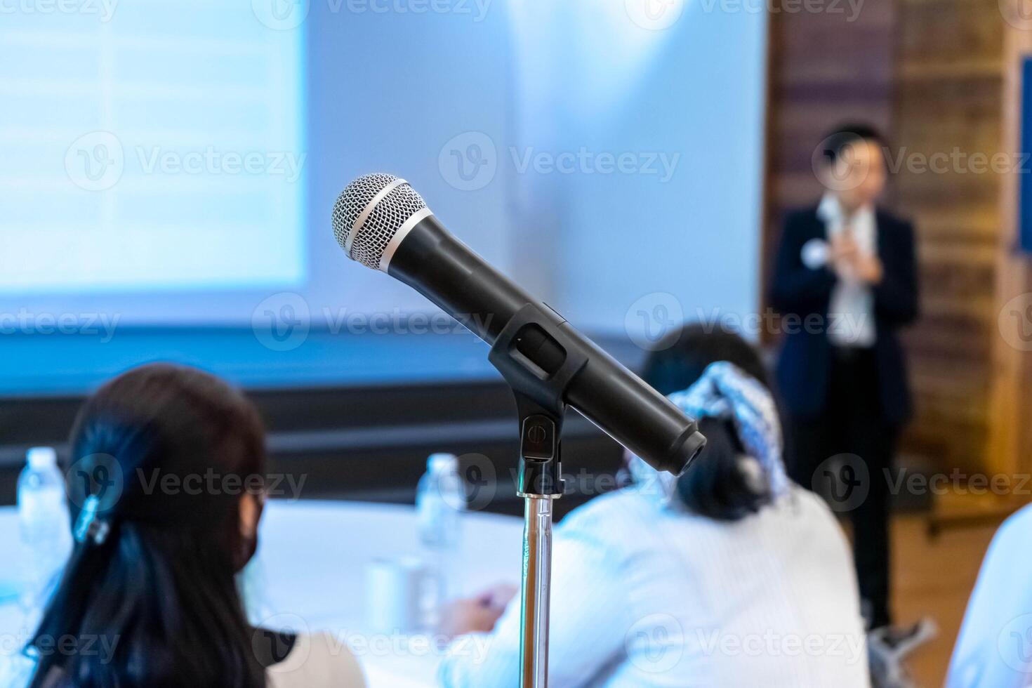 microphone is on microphone stand in seminar meeting room for everyone to use when speaking or greeting seminar participants. photo