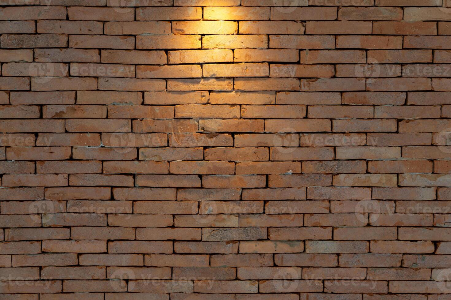 Brickwall backdrop with the tungsten lights from spotlight for Art Exhibition or vintage classic display product background. photo