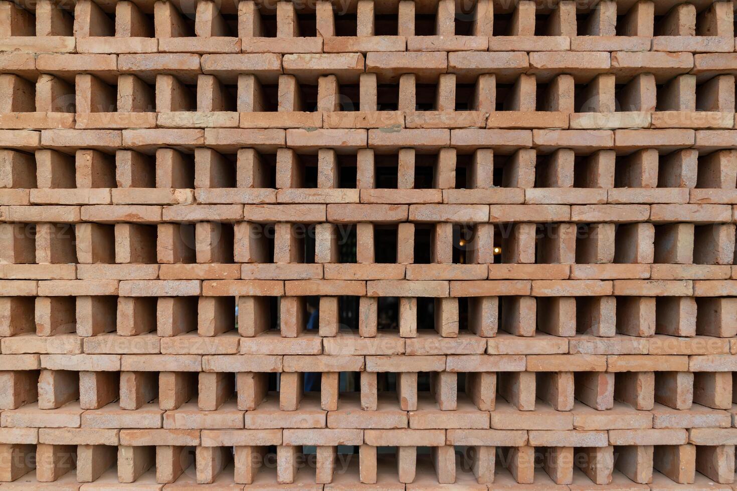 The new pattern of hole brick wall arrangement art with modern and vintage combination style for creative wall background design. photo