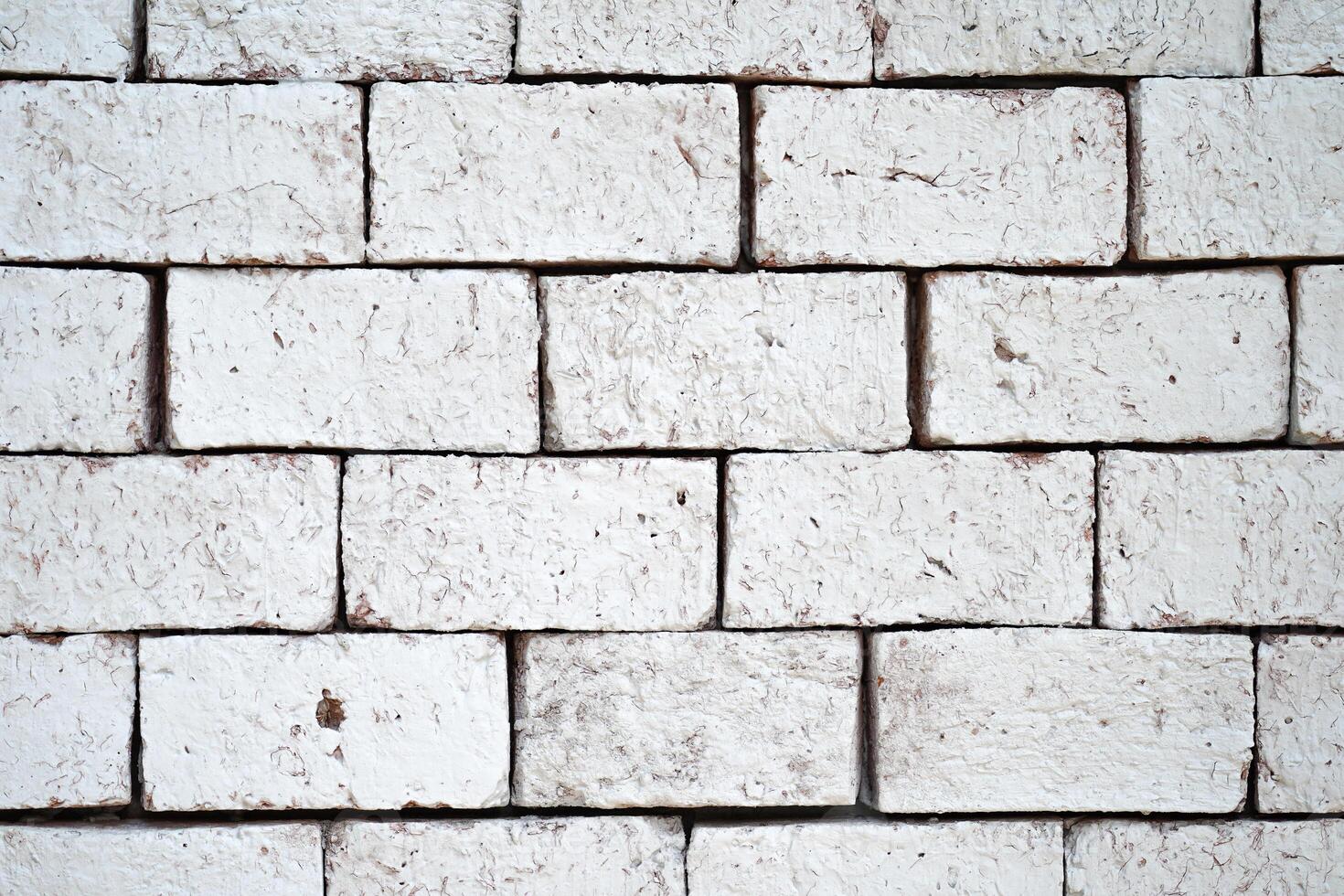 White bricks that may be part of the house's walls can be used as a background image in product advertising. photo