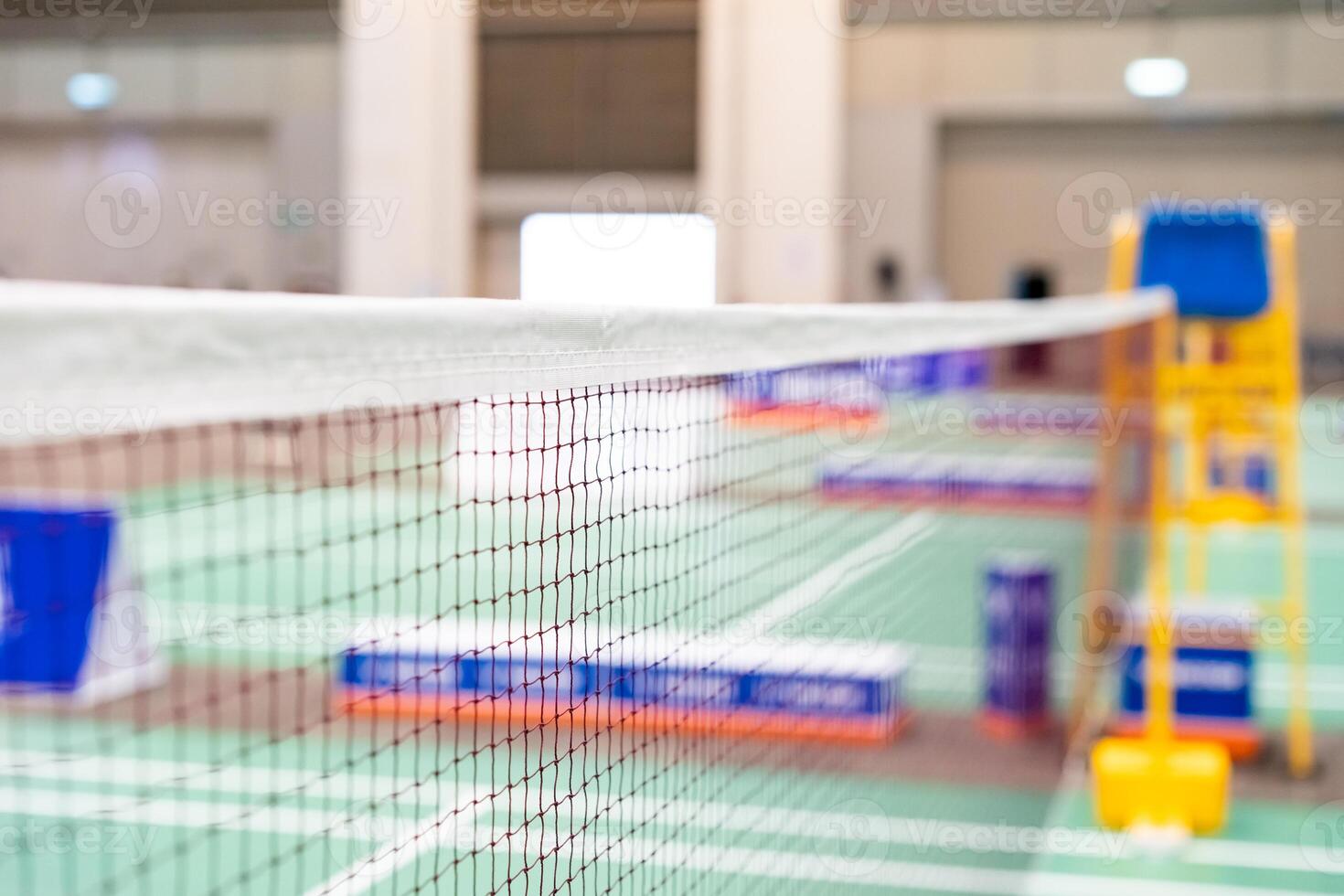 badminton net Close up shot of a used in court with blurred background in sports stadium. photo