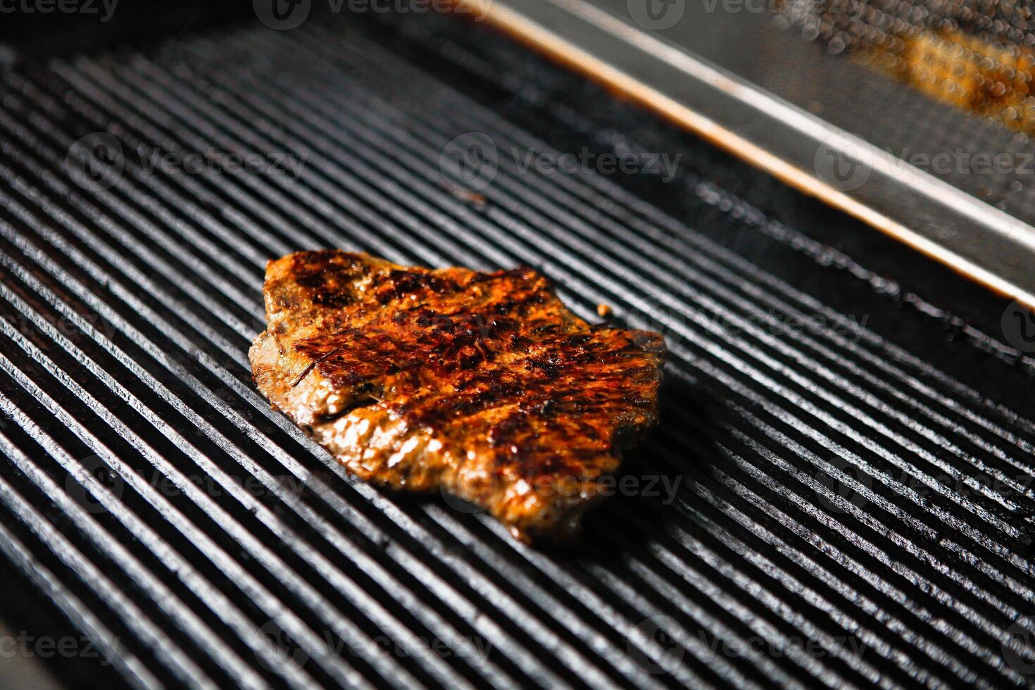 Grilled Steak on Black Grill photo