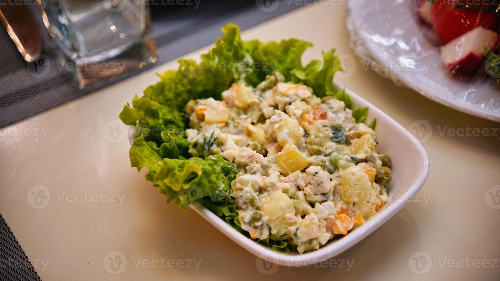 Potato Salad With Greens in a White Bowl photo