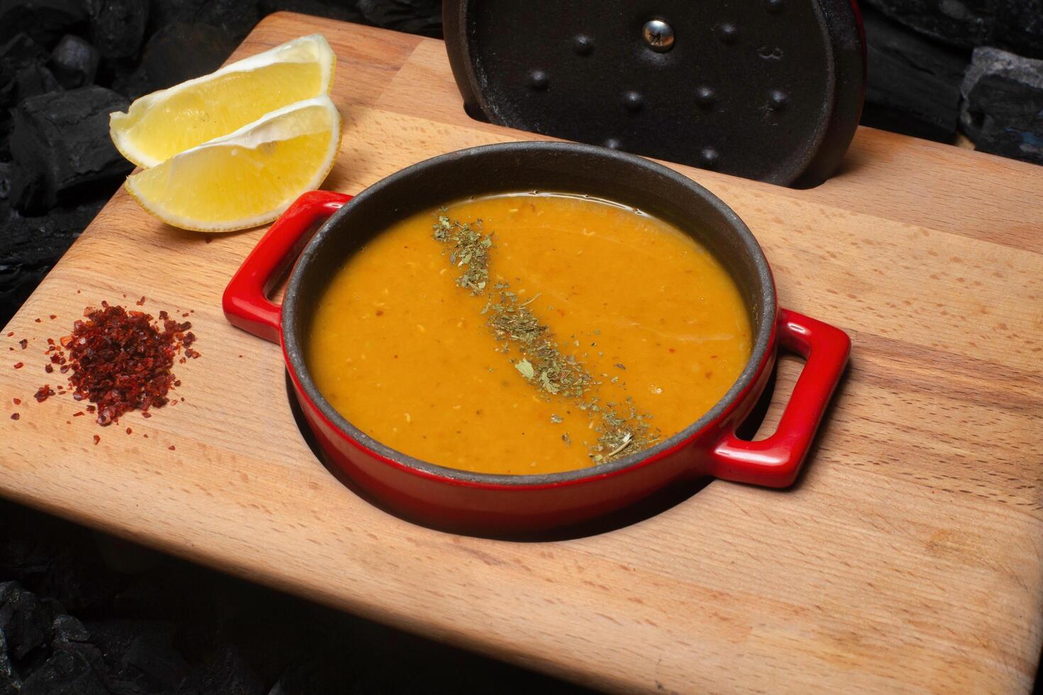 Red Pot of Lentil Soup With Lemon and Spices photo