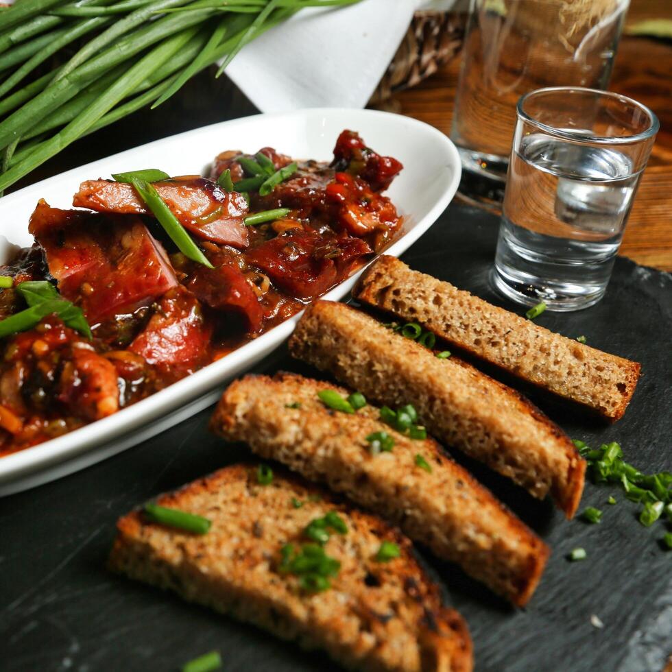 Spicy Sausage and Bread Toasts photo