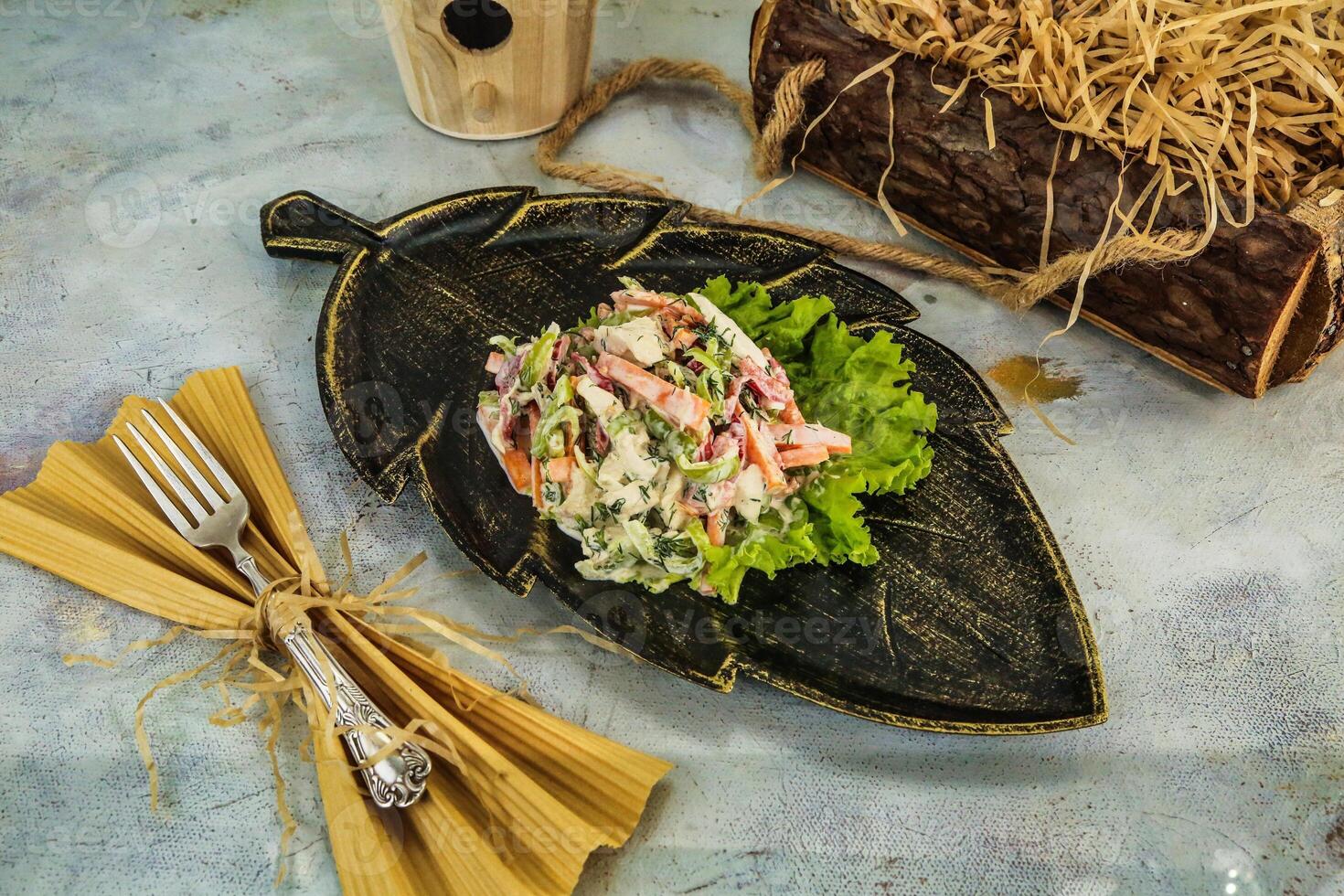 Leaf-Shaped Plate With Salad and Fork photo