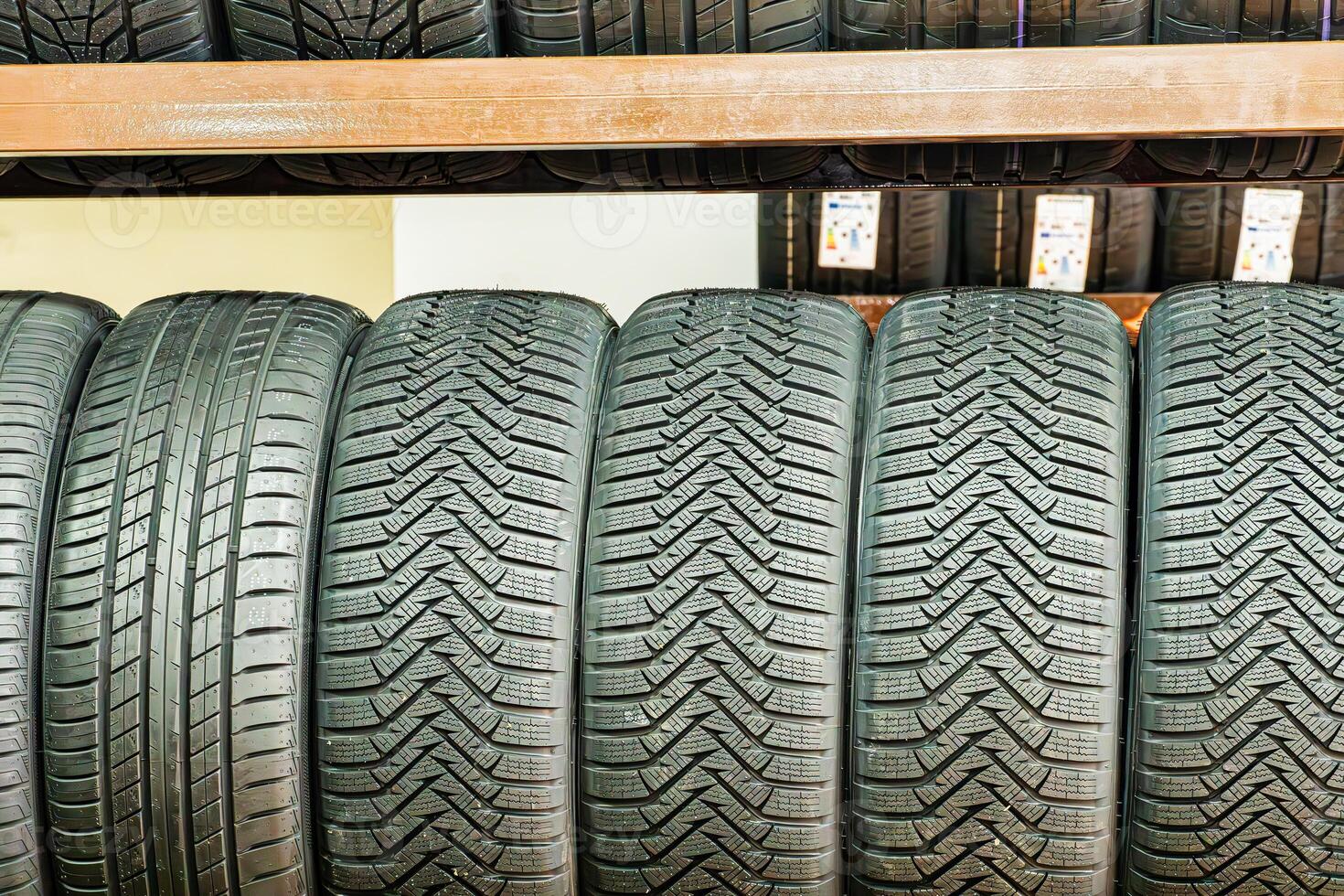 New Winter Tires on Shelf in Tire Shop photo