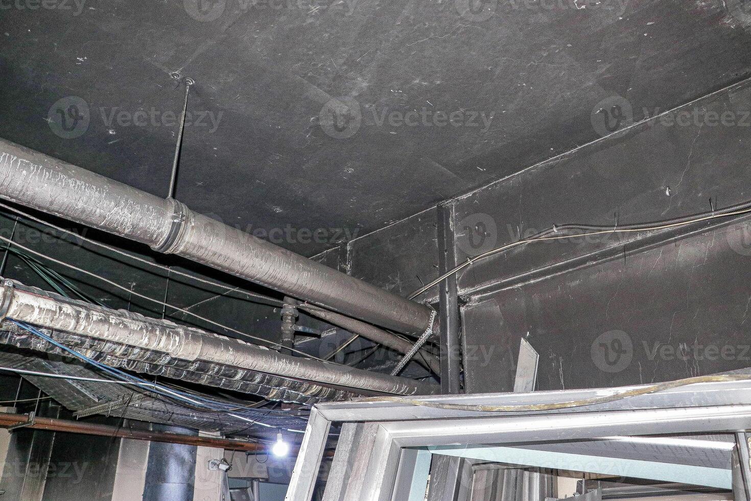 Ceiling Pipes and Wires in an Industrial Building photo
