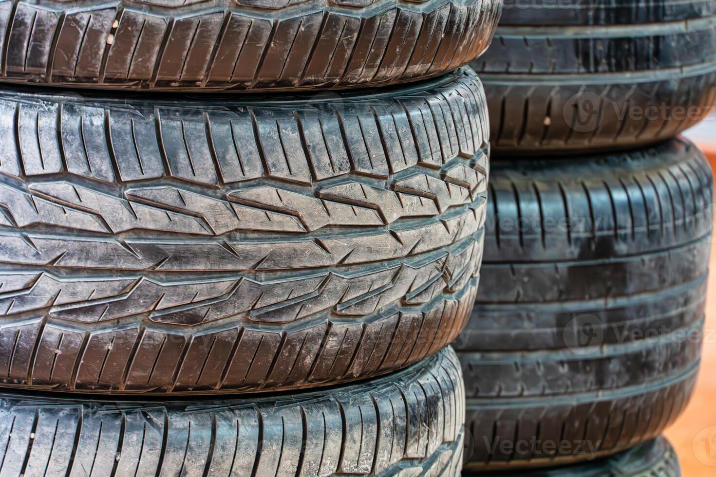 Close-Up of Stacked Used Car Tires photo
