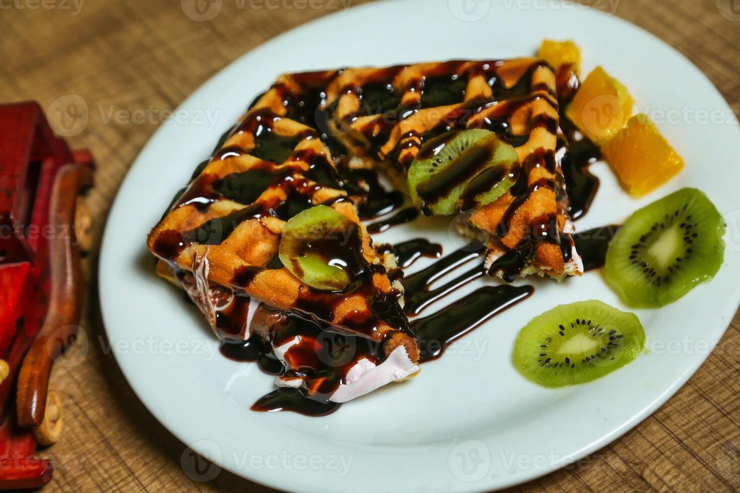 Chocolate Waffle With Kiwi and Orange photo