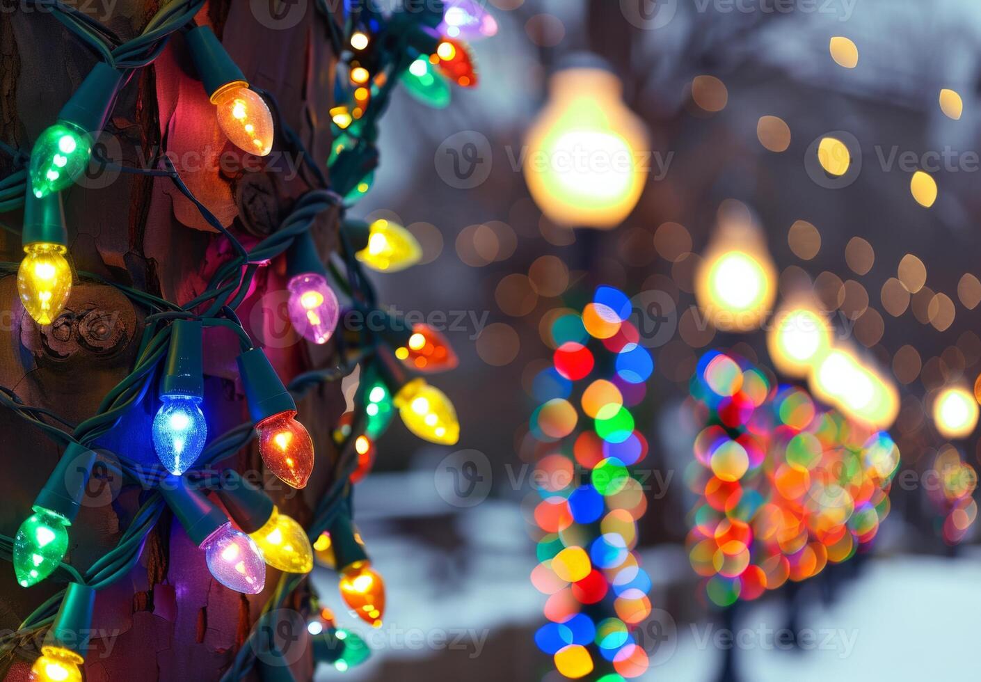 Close-up of colorful Christmas lights on a tree trunk photo
