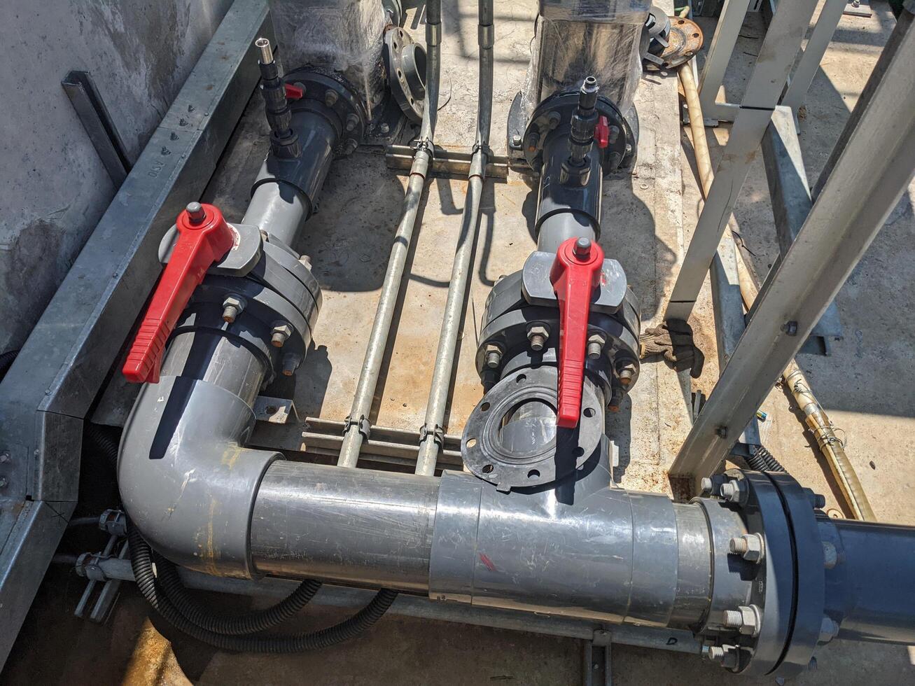 Suction service water pump Industrial Piping System Close-up image of industrial piping system with multiple valves and fittings. photo