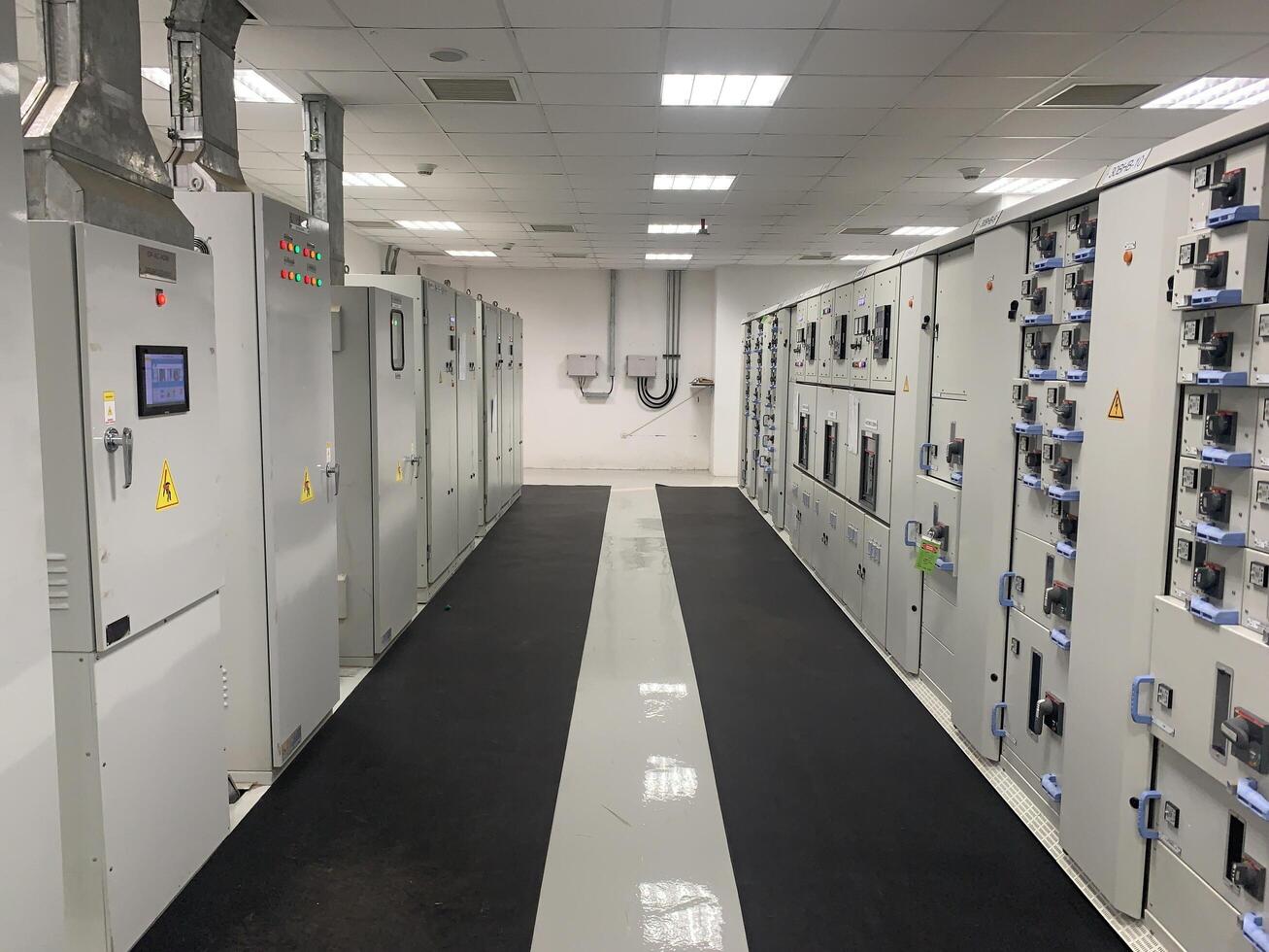 Electrical Panels in a Room with a Black Mat Power Plant photo