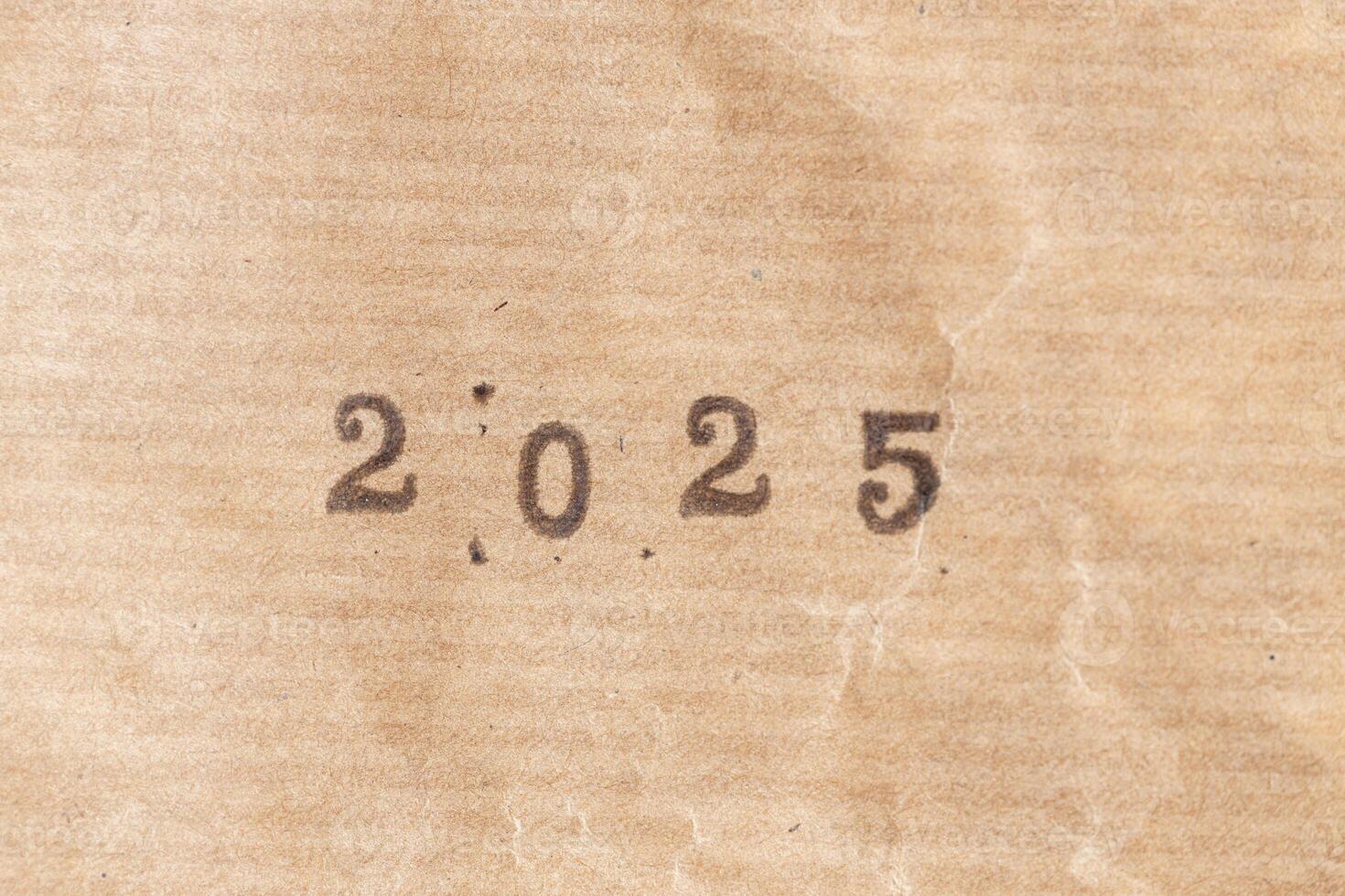 2025 ink rubber stamp on crumpled brown paper photo
