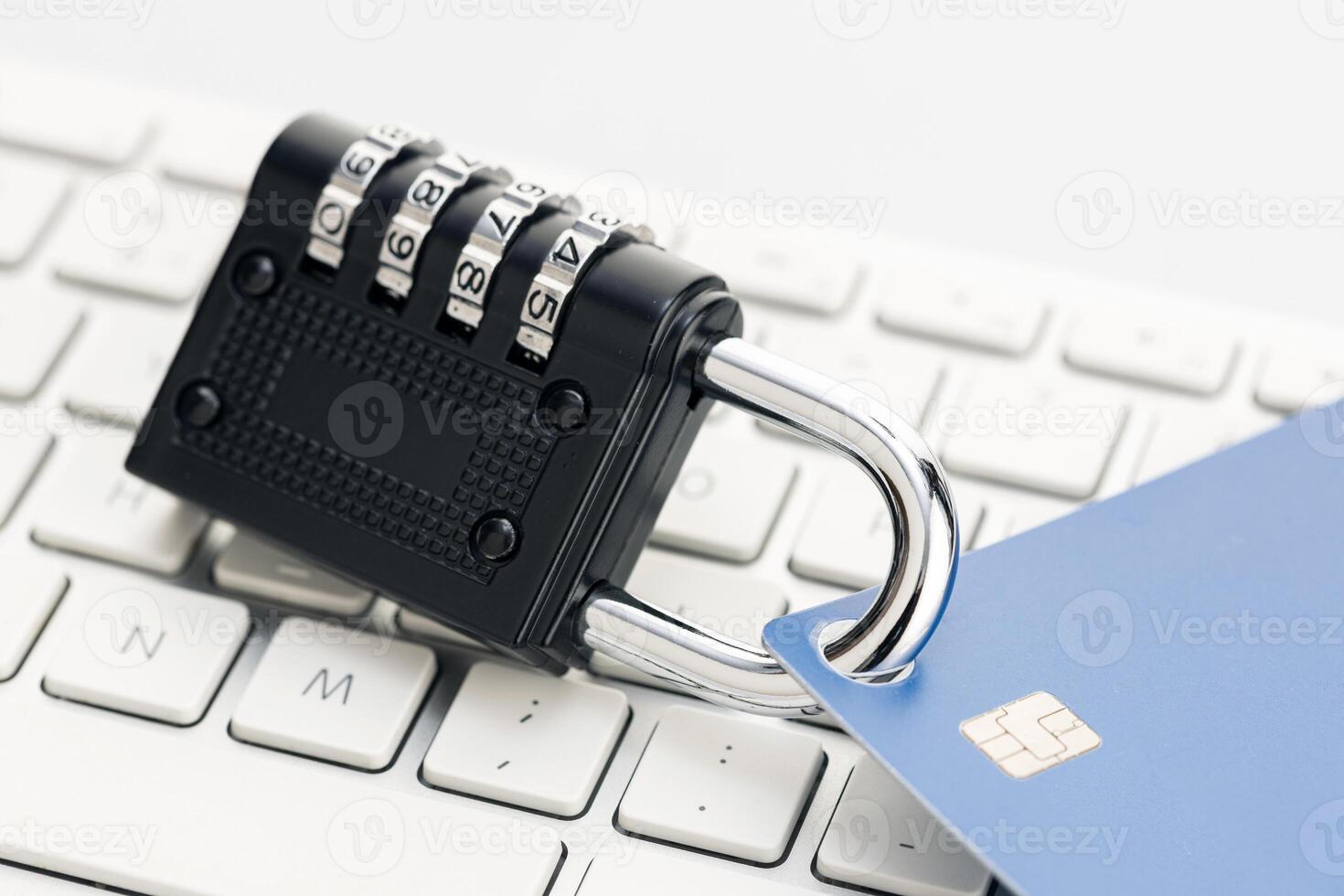 Security lock closed on credit card on computer keyboard . Financial data protection concept photo