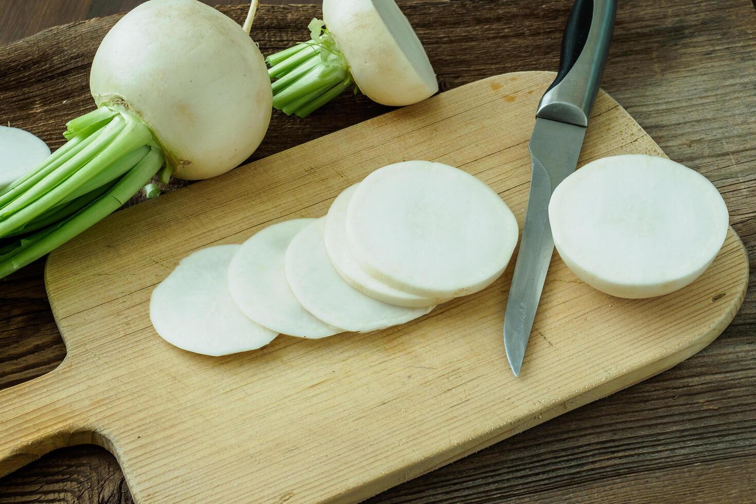 Sliced daikon radish.Tasty fresh crude white round japanese radish. photo