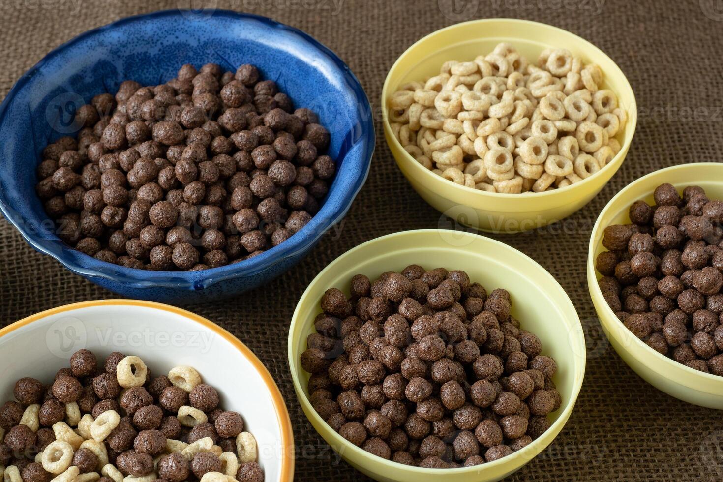 Set of various cereal bowl for breakfast. Corn rings with chocolate and cereal. photo