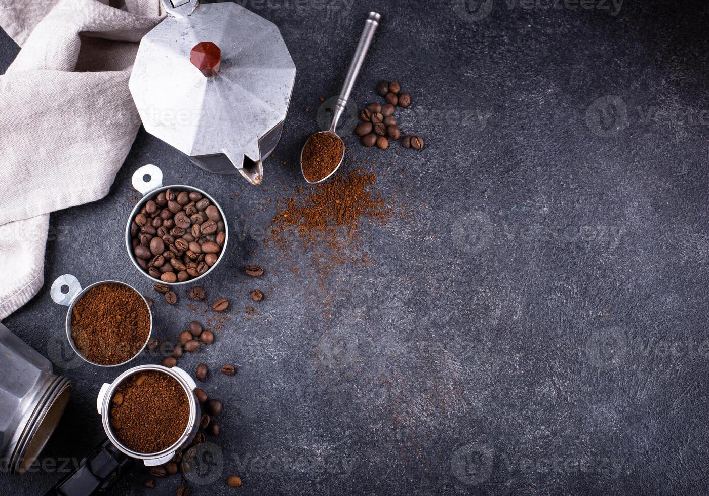 Grounded coffee, beans, coffe maker and spicces photo