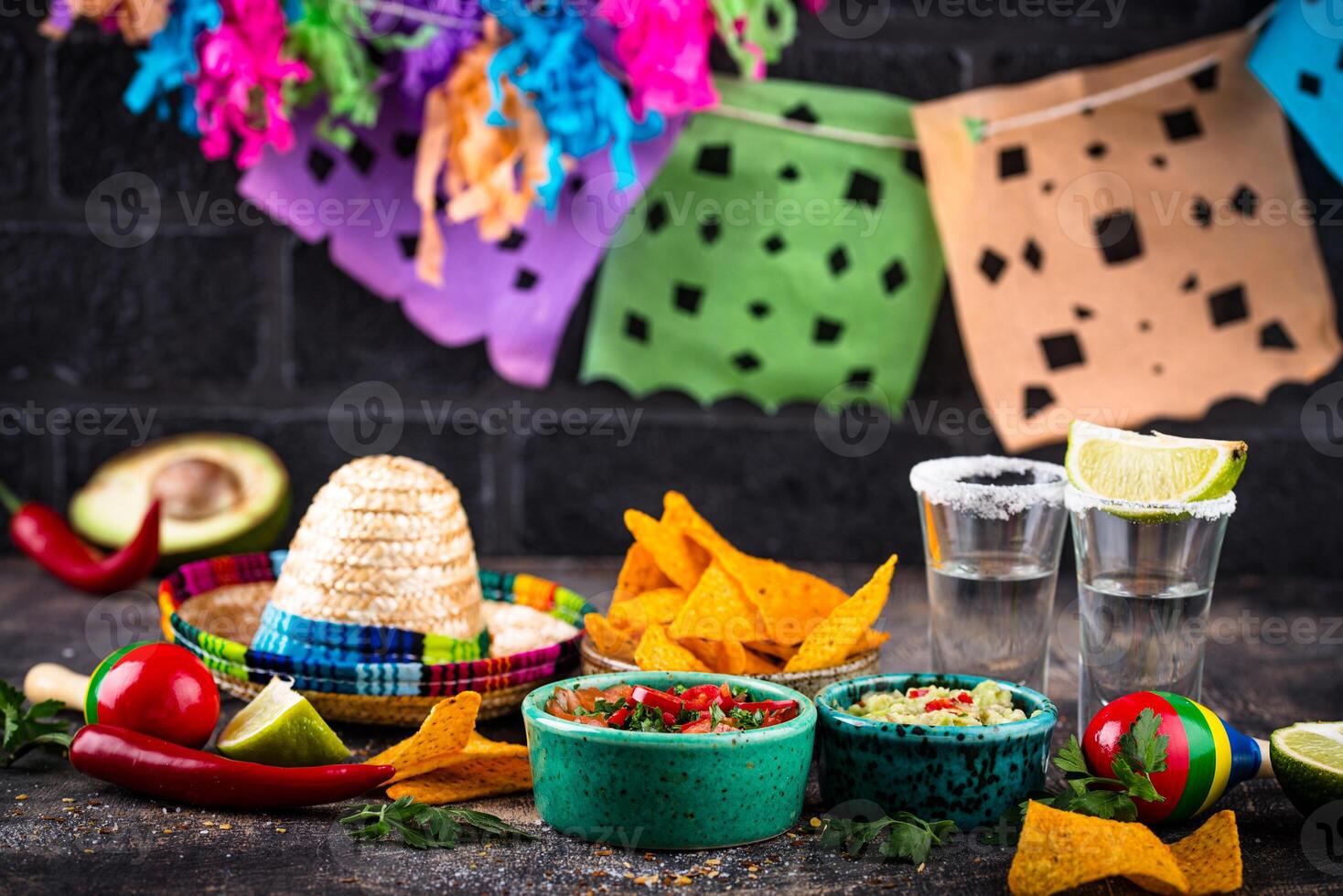 Traditional Mexican food nachos, salsa, guacamole, tequila. photo