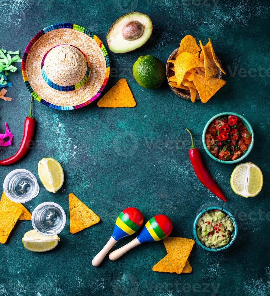 Traditional Mexican food nachos, salsa, guacamole, tequila. photo